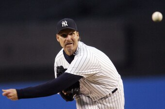 New York, UNITED STATES:  Randy Johnson of the New York Yankees pitches in the second inning against the Boston Red Sox 09 May 2006 at Yankee Stadium in the Bronx borough of New York City   AFP PHOTO/POOL  (Photo credit should read POOL/AFP via Getty Imag