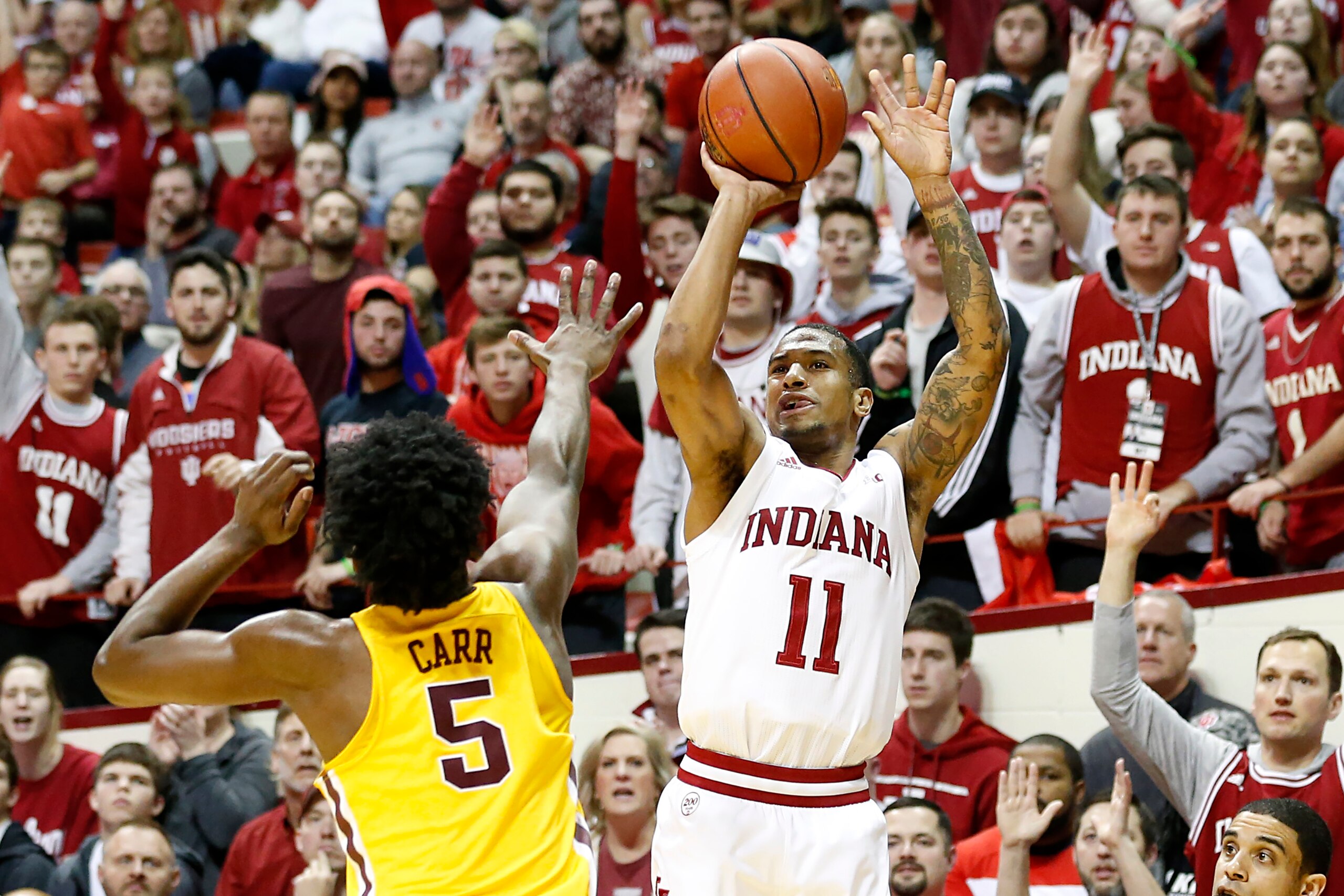 BLOOMINGTON, INDIANA - MARCH 04: Devonte Green #11 of the Indiana Hoosiers takes a shot over Marcus Carr #5 of the Minnesota Golden Gophers during the first half at Assembly Hall on March 04, 2020 in Bloomington, Indiana. (Photo by Justin Casterline/Getty BLOOMINGTON, INDIANA - MARCH 04: Devonte Green #11 of the Indiana Hoosiers takes a shot over Marcus Carr #5 of the Minnesota Golden Gophers during the first half at Assembly Hall on March 04, 2020 in Bloomington, Indiana. (Photo by Justin Casterline/Getty