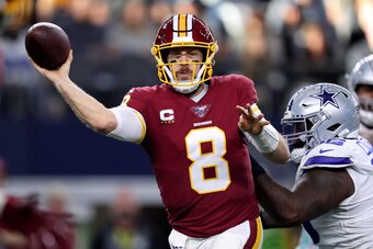 ARLINGTON, TEXAS - DECEMBER 29: Case Keenum #8 of the Washington Redskins throws a pass while being chased by Maliek Collins #96 of the Dallas Cowboys in the second quarter in the game at AT&T Stadium on December 29, 2019 in Arlington, Texas. (Photo by To