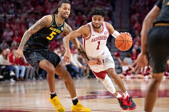 FAYETTEVILLE, AR - FEBRUARY 22:  Isaiah Joe #1 of the Arkansas Razorbacks drives to the basket against Mitchell Smith #5 of the Missouri Tigers at Bud Walton Arena on February 22, 2020 in Fayetteville, Arkansas.  The Razorbacks defeated the Tigers 78-68. 