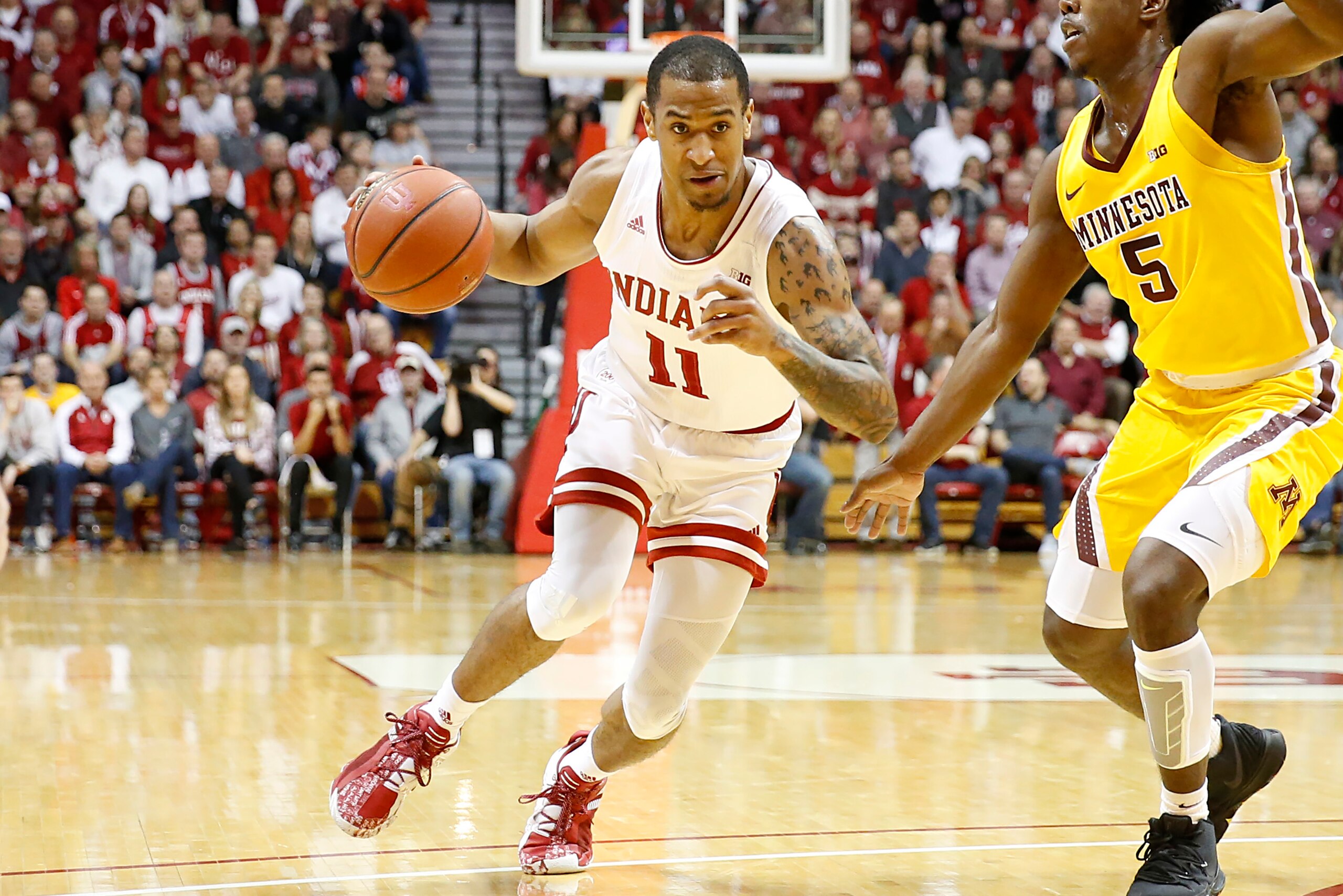 BLOOMINGTON, INDIANA - MARCH 04: Devonte Green #11 of the Indiana Hoosiers drives to the basket while being guarded by Marcus Carr #5 of the Minnesota Golden Gophers at Assembly Hall on March 04, 2020 in Bloomington, Indiana. (Photo by Justin Casterline/G BLOOMINGTON, INDIANA - MARCH 04: Devonte Green #11 of the Indiana Hoosiers drives to the basket while being guarded by Marcus Carr #5 of the Minnesota Golden Gophers at Assembly Hall on March 04, 2020 in Bloomington, Indiana. (Photo by Justin Casterline/G