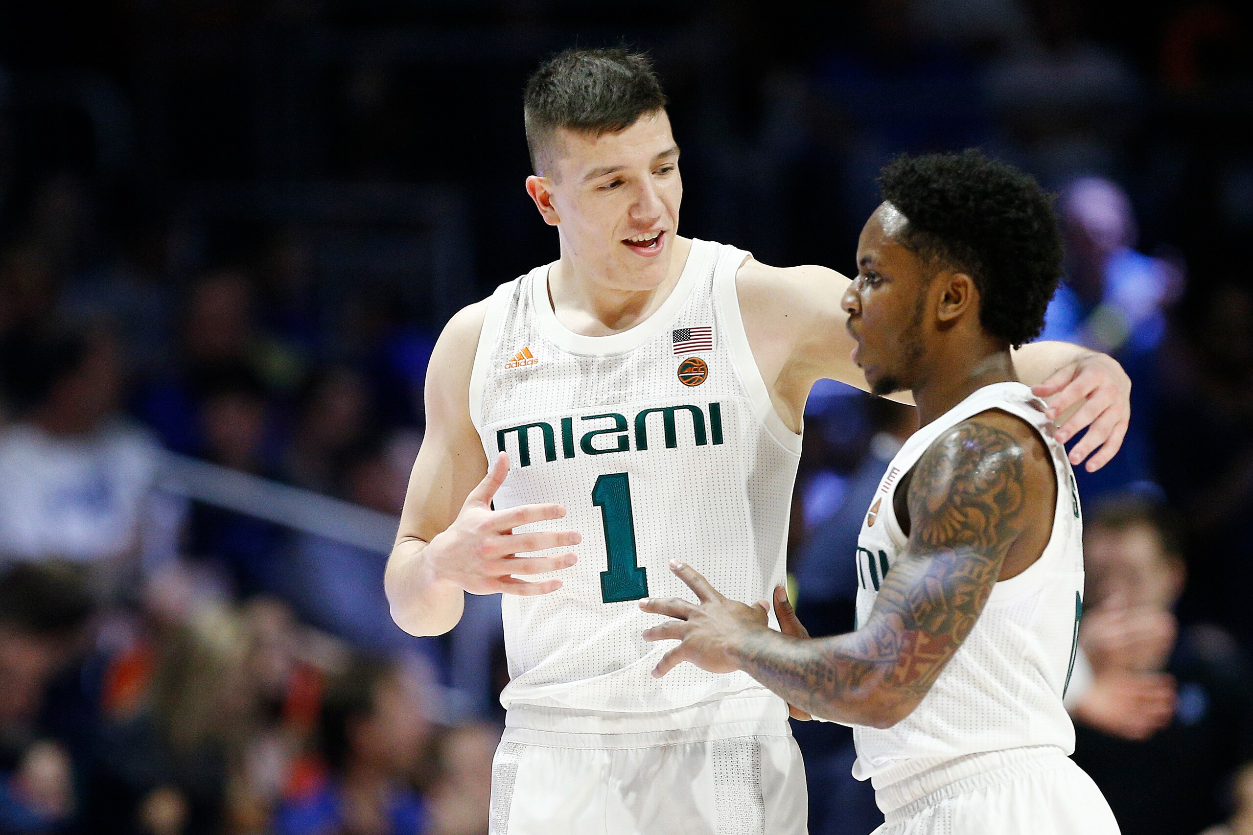 MIAMI, FLORIDA - JANUARY 04: Dejan Vasiljevic #1 of the Miami Hurricanes talks with Chris Lykes #0 against the Duke Blue Devils during the first half at the Watsco Center on January 04, 2020 in Miami, Florida. (Photo by Michael Reaves/Getty Images) MIAMI, FLORIDA - JANUARY 04: Dejan Vasiljevic #1 of the Miami Hurricanes talks with Chris Lykes #0 against the Duke Blue Devils during the first half at the Watsco Center on January 04, 2020 in Miami, Florida. (Photo by Michael Reaves/Getty Images)