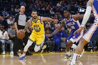 SAN FRANCISCO, CALIFORNIA - MARCH 07: Mychal Mulder #15 of the Golden State Warriors drives to the basket against Shake Milton #18 of the Philadelphia 76ers in the second half at Chase Center on March 07, 2020 in San Francisco, California. NOTE TO USER: U