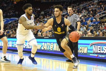 NEWARK, NJ - FEBRUARY 07:  Markus Howard #0 of the Marquette Golden Eagles dribbles the ball around Myles Powell #13 of the Seton Hall Pirates during a college basketball game at the Prudential Center on February 7, 2018 in Newark, New Jersey.  The Golden