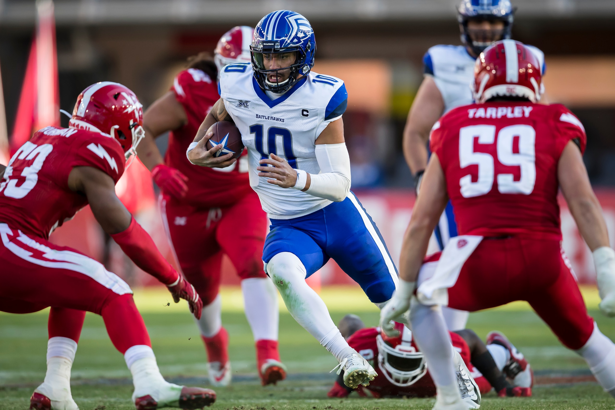 WASHINGTON, DC - MARCH 08: Jordan Ta'Amu #10 of the St. Louis Battlehawks scrambles against the DC Defenders during the second half of the XFL game at Audi Field on March 8, 2020 in Washington, DC. (Photo by Scott Taetsch/Getty Images)