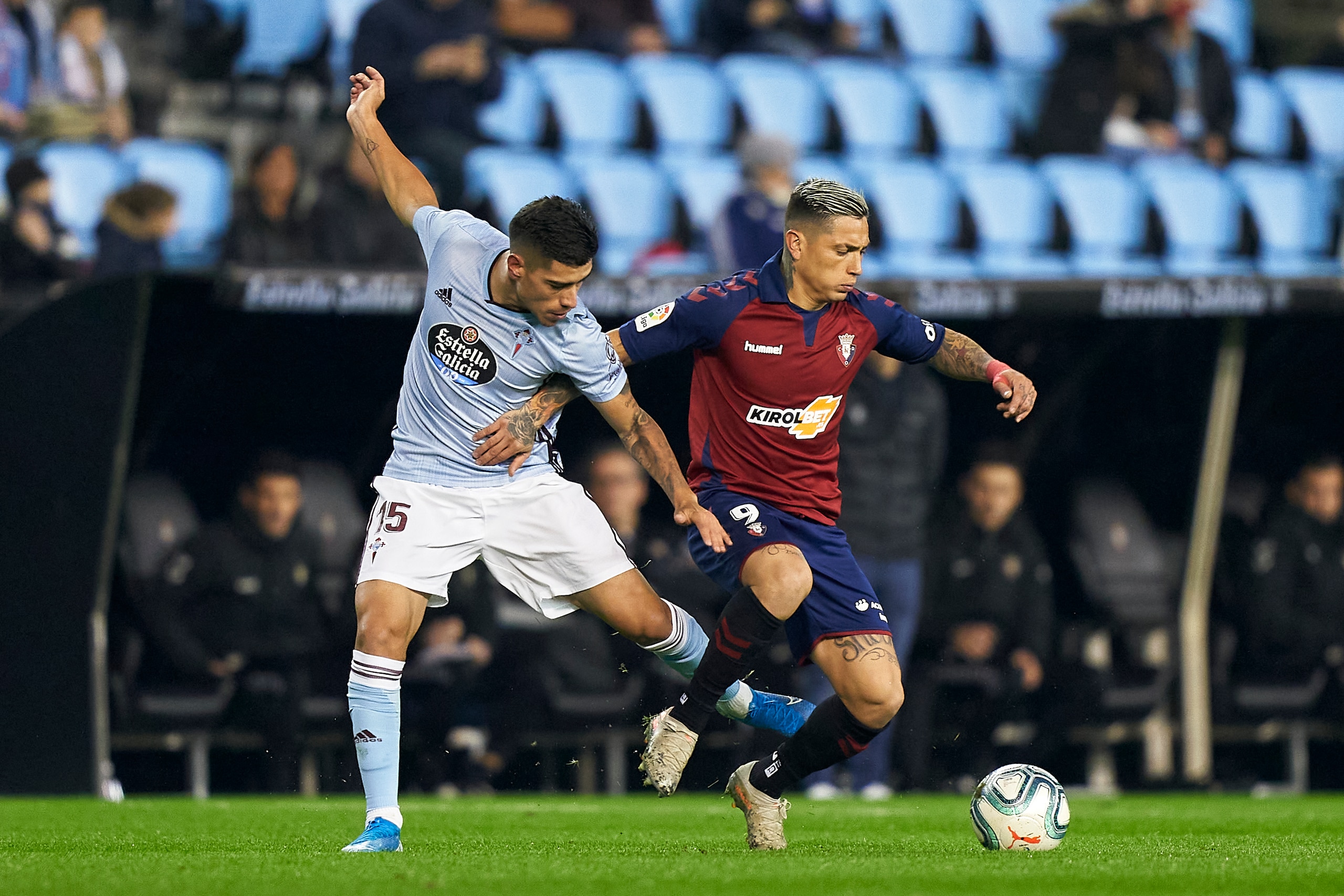 VIGO, SPAIN - JANUARY 05: Lucas Olaza of Celta de Vigo competes for the ball with Chimy Avila of CA Osasuna during the Liga match between RC Celta de Vigo and CA Osasuna at Abanca-Balaídos on January 05, 2020 in Vigo, Spain. (Photo by Quality Sport Images