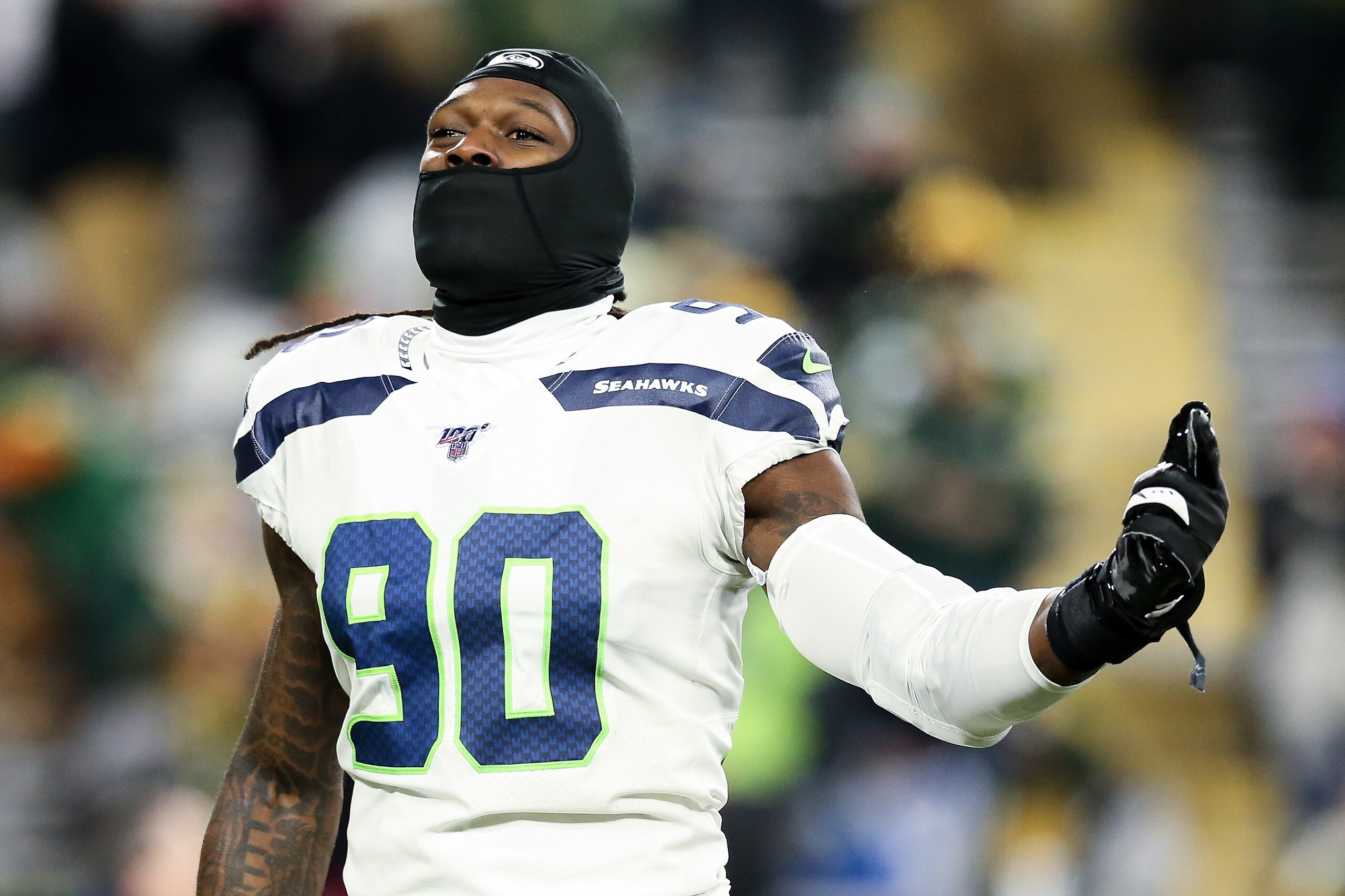 GREEN BAY, WISCONSIN - JANUARY 12: Jadeveon Clowney #90 of the Seattle Seahawks warms up before the NFC Divisional Round Playoff game against the Green Bay Packers at Lambeau Field on January 12, 2020 in Green Bay, Wisconsin. (Photo by Dylan Buell/Getty I GREEN BAY, WISCONSIN - JANUARY 12: Jadeveon Clowney #90 of the Seattle Seahawks warms up before the NFC Divisional Round Playoff game against the Green Bay Packers at Lambeau Field on January 12, 2020 in Green Bay, Wisconsin. (Photo by Dylan Buell/Getty I