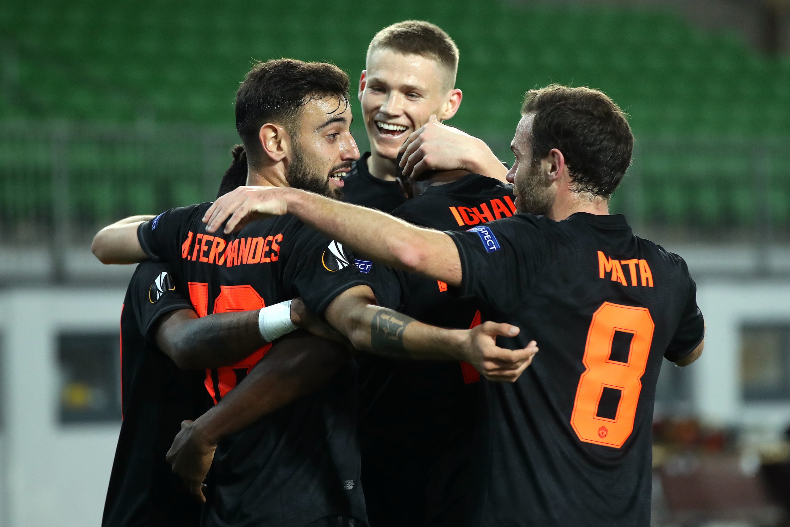 LINZ, AUSTRIA - MARCH 12: (FREE FOR EDITORIAL USE) In this handout image provided by UEFA, Odion Ighalo of Manchester United celebrates with Fred, Bruno Fernandes, Brandon Williams and Juan Mata after scoring his team's first goal during the UEFA Europa L
