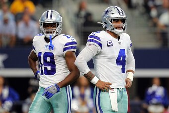 ARLINGTON, TEXAS - OCTOBER 06: Amari Cooper #19 and Dak Prescott #4 of the Dallas Cowboys stand on the field in the first quarter against the Green Bay Packers at AT&T Stadium on October 06, 2019 in Arlington, Texas. (Photo by Richard Rodriguez/Getty Imag