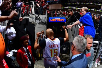ATLANTA, GA - MARCH 11: Vince Carter #15 of the Atlanta Hawks fist bumps the fans after the game against the New York Knicks on March 11, 2020 at State Farm Arena in Atlanta, Georgia.  NOTE TO USER: User expressly acknowledges and agrees that, by download