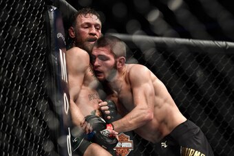 LAS VEGAS, NV - OCTOBER 06:   (R-L) Khabib Nurmagomedov of Russia pushes Conor McGregor of Ireland up against the cage in their UFC lightweight championship bout during the UFC 229 event inside T-Mobile Arena on October 6, 2018 in Las Vegas, Nevada. (Phot