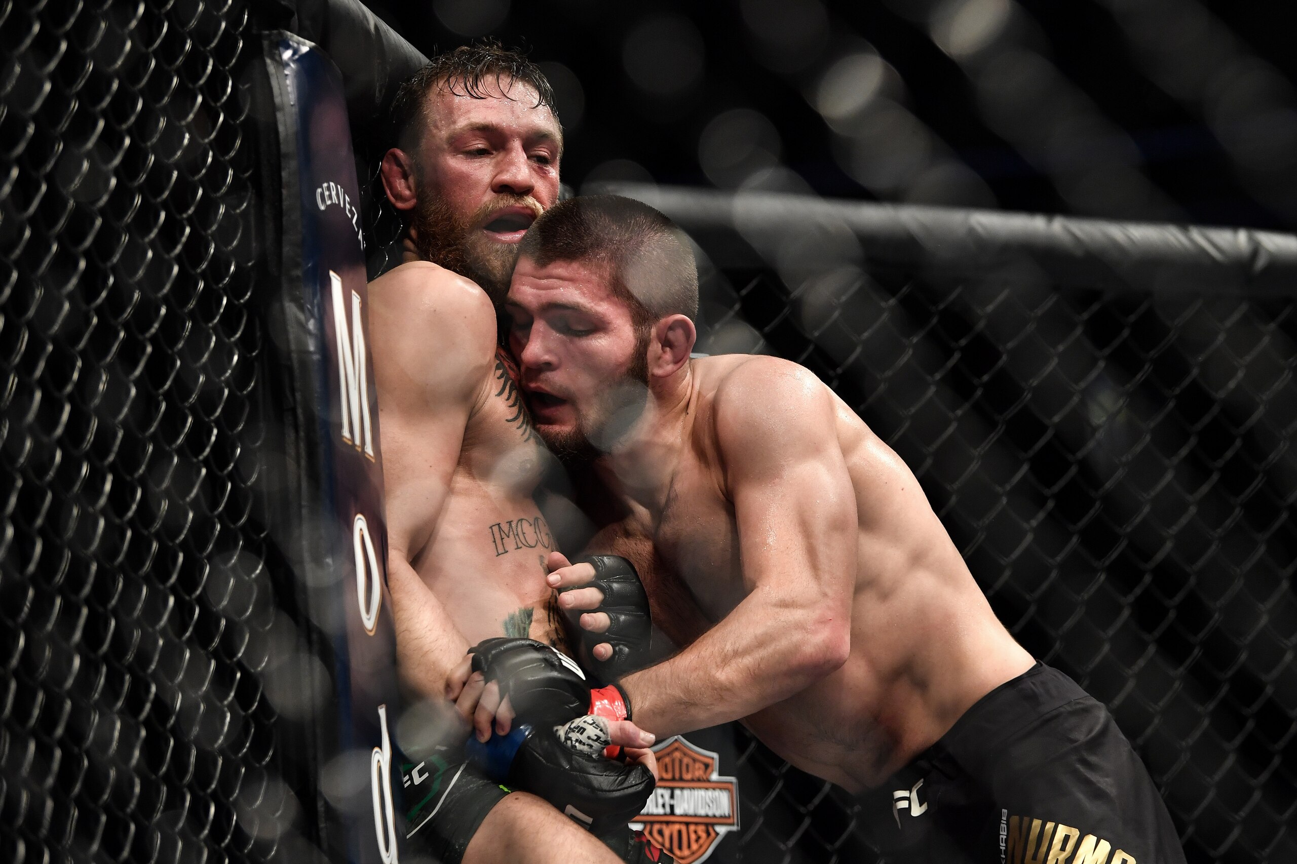 LAS VEGAS, NV - OCTOBER 06: (R-L) Khabib Nurmagomedov of Russia pushes Conor McGregor of Ireland up against the cage in their UFC lightweight championship bout during the UFC 229 event inside T-Mobile Arena on October 6, 2018 in Las Vegas, Nevada. (Phot LAS VEGAS, NV - OCTOBER 06: (R-L) Khabib Nurmagomedov of Russia pushes Conor McGregor of Ireland up against the cage in their UFC lightweight championship bout during the UFC 229 event inside T-Mobile Arena on October 6, 2018 in Las Vegas, Nevada. (Phot