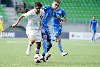Trincao Francisco of Portugal (L) and Kyrylo Dryshliuk of Ukraine vie for the ball during the football 2018 UEFA European Under-19 Championship semifinal match Ukraine vs Portugal in Vaasa, Finland on July 26, 2018. (Photo by Timo Aalto / Lehtikuva / AFP)