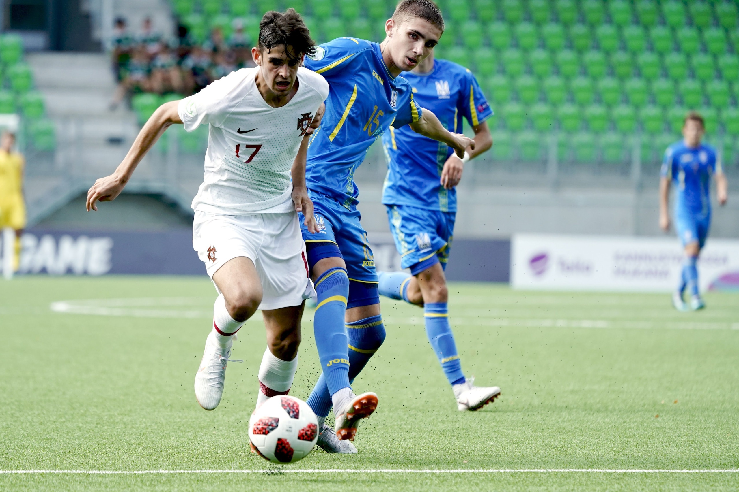 Trincao Francisco of Portugal (L) and Kyrylo Dryshliuk of Ukraine vie for the ball during the football 2018 UEFA European Under-19 Championship semifinal match Ukraine vs Portugal in Vaasa, Finland on July 26, 2018. (Photo by Timo Aalto / Lehtikuva / AFP)