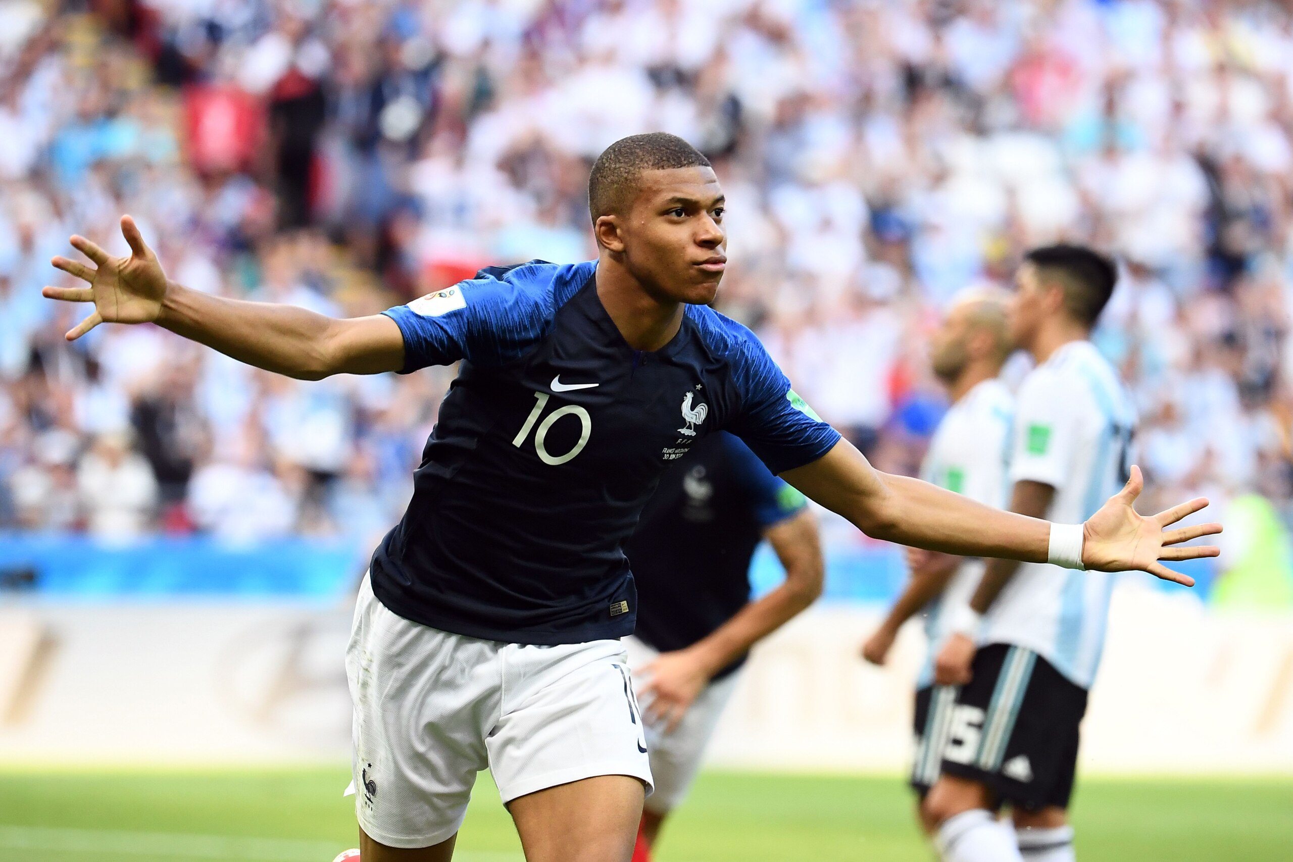 TOPSHOT - France's forward Kylian Mbappe celebrates after scoring their third goal during the Russia 2018 World Cup round of 16 football match between France and Argentina at the Kazan Arena in Kazan on June 30, 2018. (Photo by FRANCK FIFE / AFP) / RESTRI