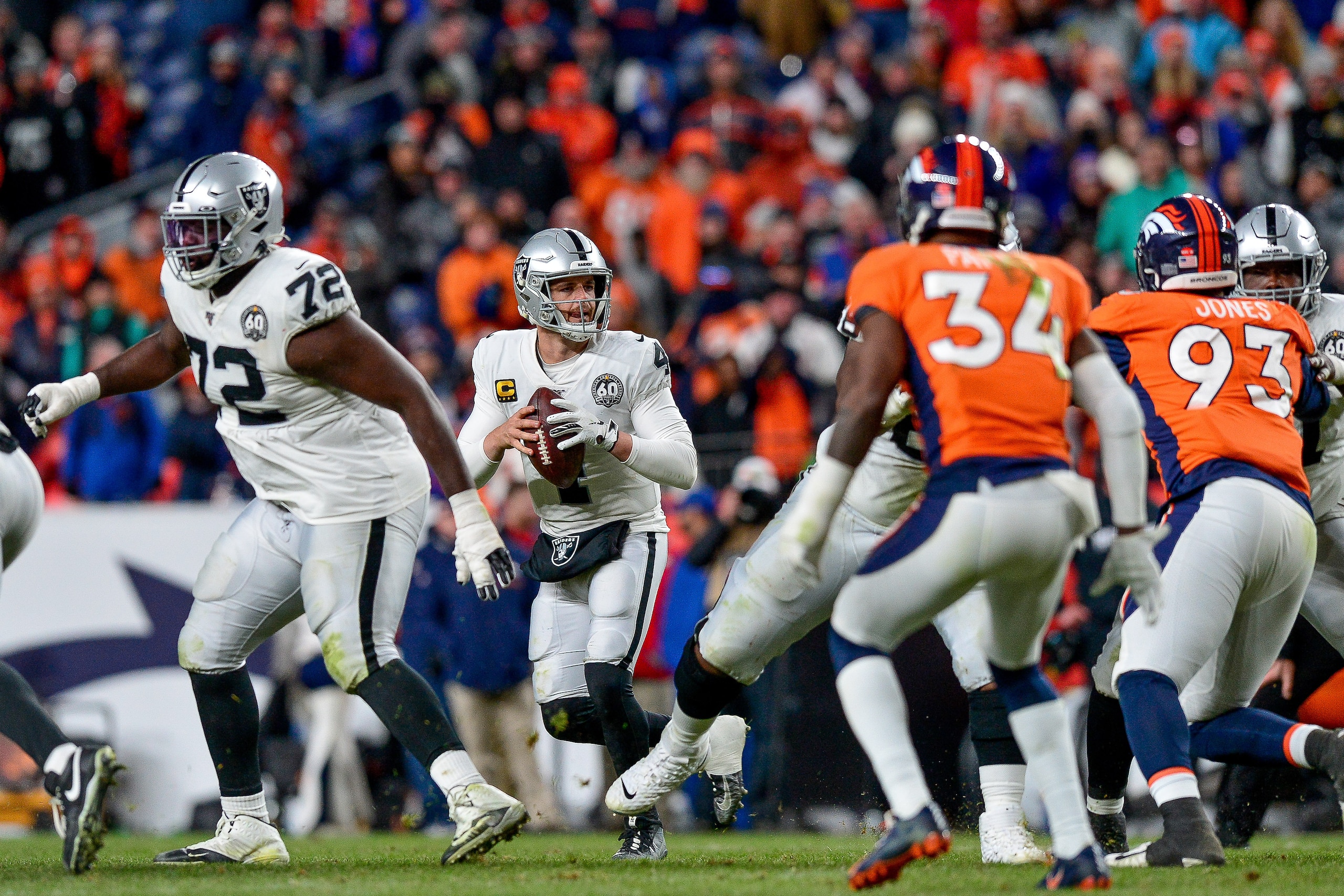 DENVER, CO - DECEMBER 29: Derek Carr #4 of the Oakland Raiders sets to pass against the Denver Broncos at Empower Field at Mile High on December 29, 2019 in Denver, Colorado. (Photo by Dustin Bradford/Getty Images) DENVER, CO - DECEMBER 29: Derek Carr #4 of the Oakland Raiders sets to pass against the Denver Broncos at Empower Field at Mile High on December 29, 2019 in Denver, Colorado. (Photo by Dustin Bradford/Getty Images)