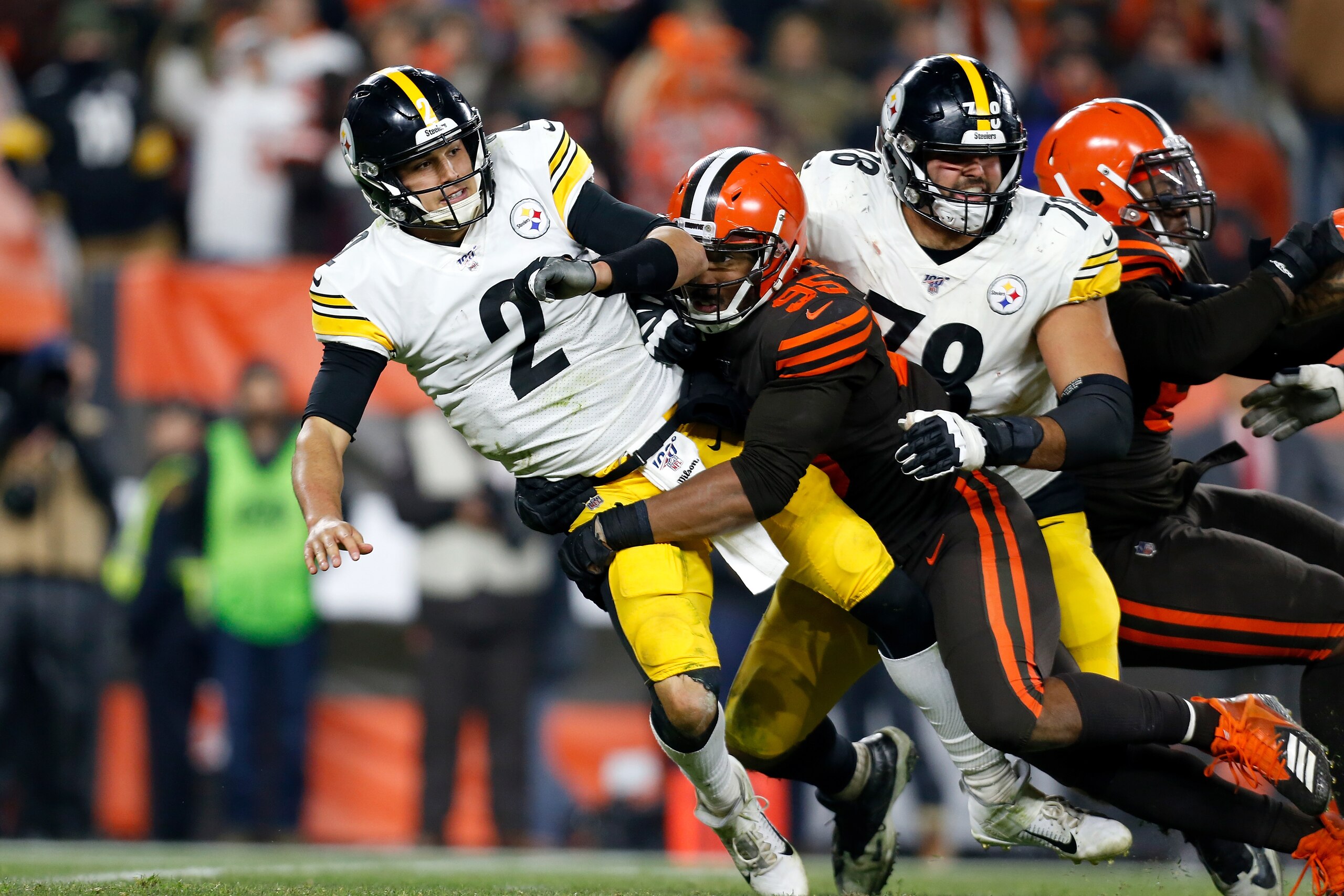 CLEVELAND, OH - NOVEMBER 14: Mason Rudolph #2 of the Pittsburgh Steelers is knocked down by Myles Garrett #95 of the Cleveland Browns during the game at FirstEnergy Stadium on November 14, 2019 in Cleveland, Ohio. (Photo by Kirk Irwin/Getty Images) CLEVELAND, OH - NOVEMBER 14: Mason Rudolph #2 of the Pittsburgh Steelers is knocked down by Myles Garrett #95 of the Cleveland Browns during the game at FirstEnergy Stadium on November 14, 2019 in Cleveland, Ohio. (Photo by Kirk Irwin/Getty Images)