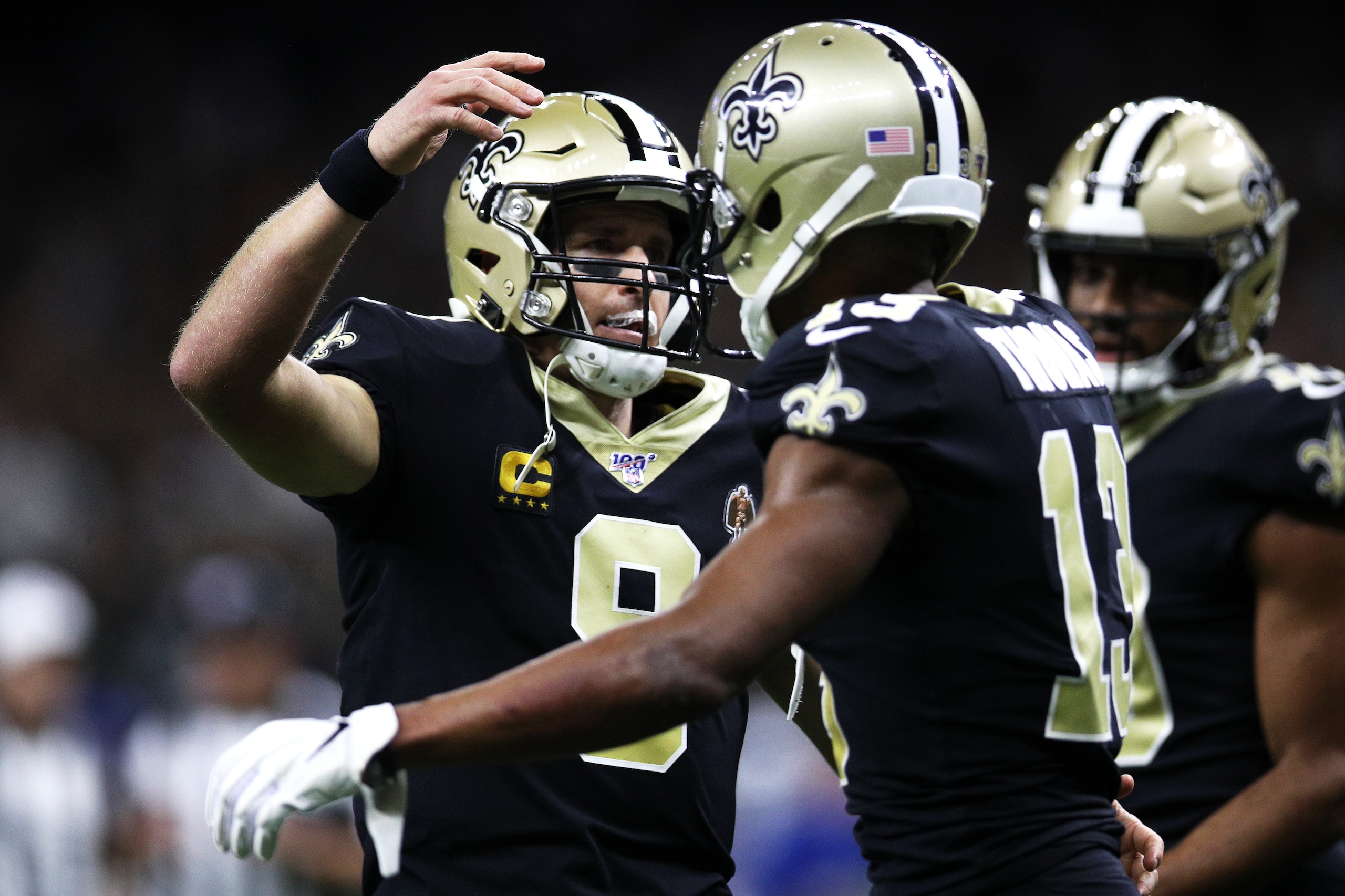 NEW ORLEANS, LOUISIANA - DECEMBER 16: Quarterback Drew Brees #9 of the New Orleans Saints congratulates wide receiver Michael Thomas #13 on a touchdown in the second quarter of the game against the Indianapolis Colts at Mercedes Benz Superdome on Decembe NEW ORLEANS, LOUISIANA - DECEMBER 16: Quarterback Drew Brees #9 of the New Orleans Saints congratulates wide receiver Michael Thomas #13 on a touchdown in the second quarter of the game against the Indianapolis Colts at Mercedes Benz Superdome on Decembe