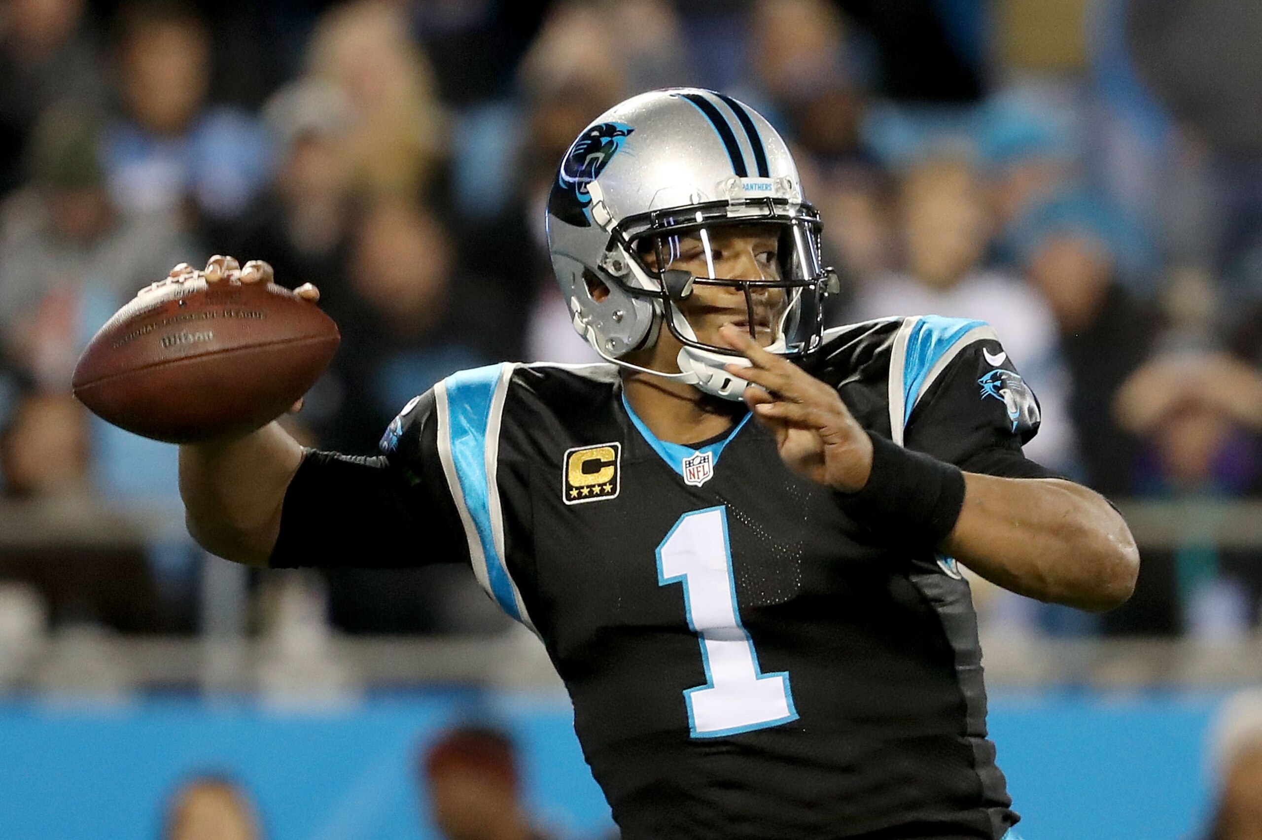 CHARLOTTE, NC - DECEMBER 17:  Cam Newton #1 of the Carolina Panthers drops back to pass against the New Orleans Saints in the first quarter during their game at Bank of America Stadium on December 17, 2018 in Charlotte, North Carolina.  (Photo by Streeter