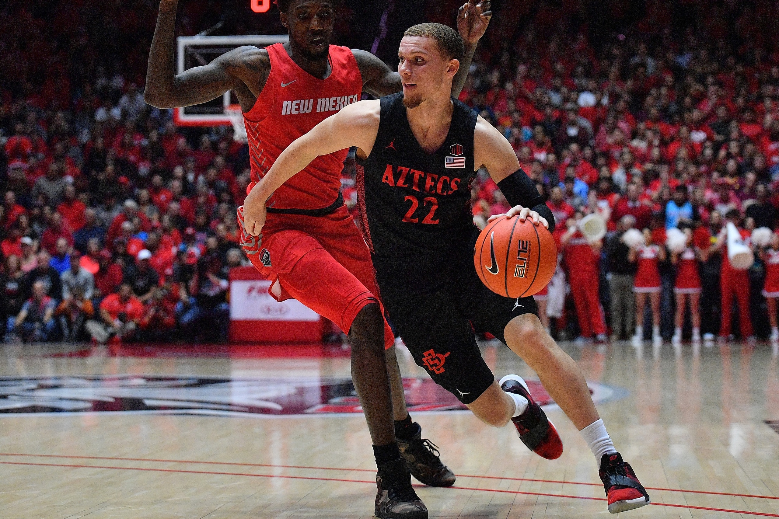 ALBUQUERQUE, NEW MEXICO - JANUARY 29:  Malachi Flynn #22 of the San Diego State Aztecs drives against Corey Manigault #1 of the New Mexico Lobos during their game at Dreamstyle Arena - The Pit on January 29, 2020 in Albuquerque, New Mexico.  (Photo by Sam