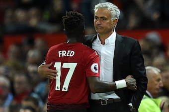 Manchester United's Portuguese manager Jose Mourinho (R) gestures with Manchester United's Brazilian midfielder Fred during the English Premier League football match between Manchester United and Leicester City at Old Trafford in Manchester, north west En