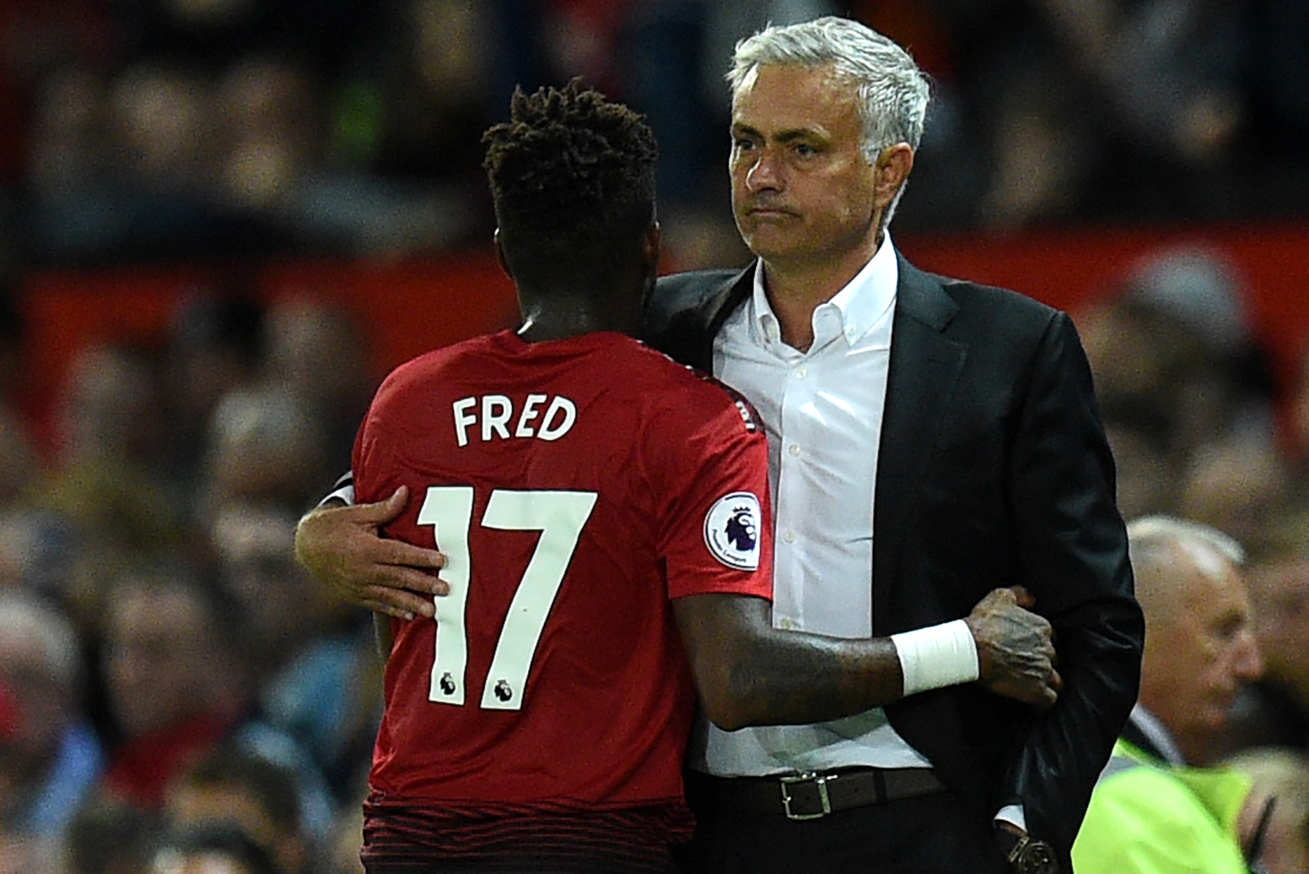 Manchester United's Portuguese manager Jose Mourinho (R) gestures with Manchester United's Brazilian midfielder Fred during the English Premier League football match between Manchester United and Leicester City at Old Trafford in Manchester, north west En