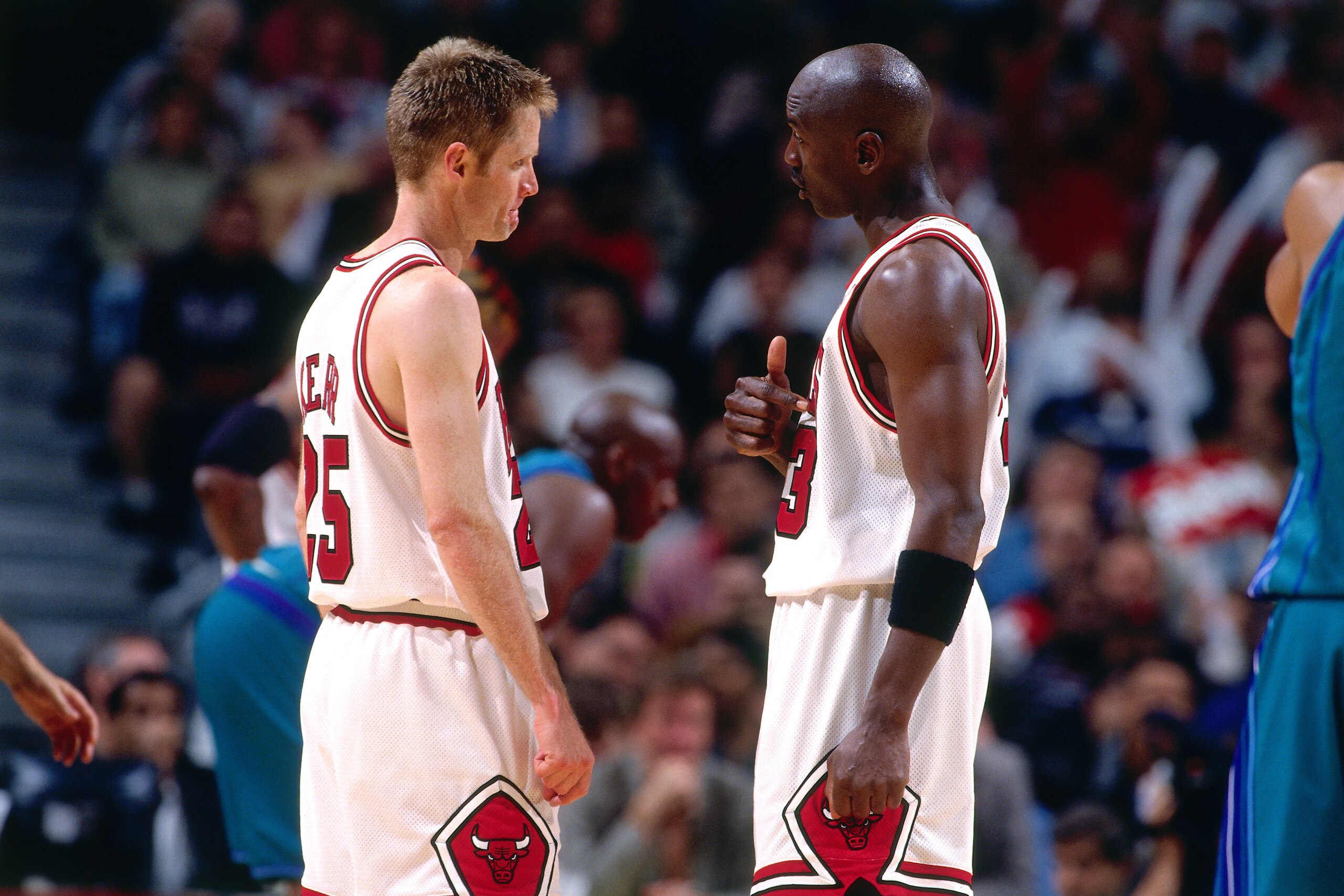 CHICAGO - MAY 3:  Michael Jordan #23 of the Chicago Bulls talks to Steve Kerr #25 of the Chicago Bulls during a game played on May 3, 1998 at the United Center in Chicago, Illinois.  NOTE TO USER: User expressly acknowledges and agrees that, by downloadin