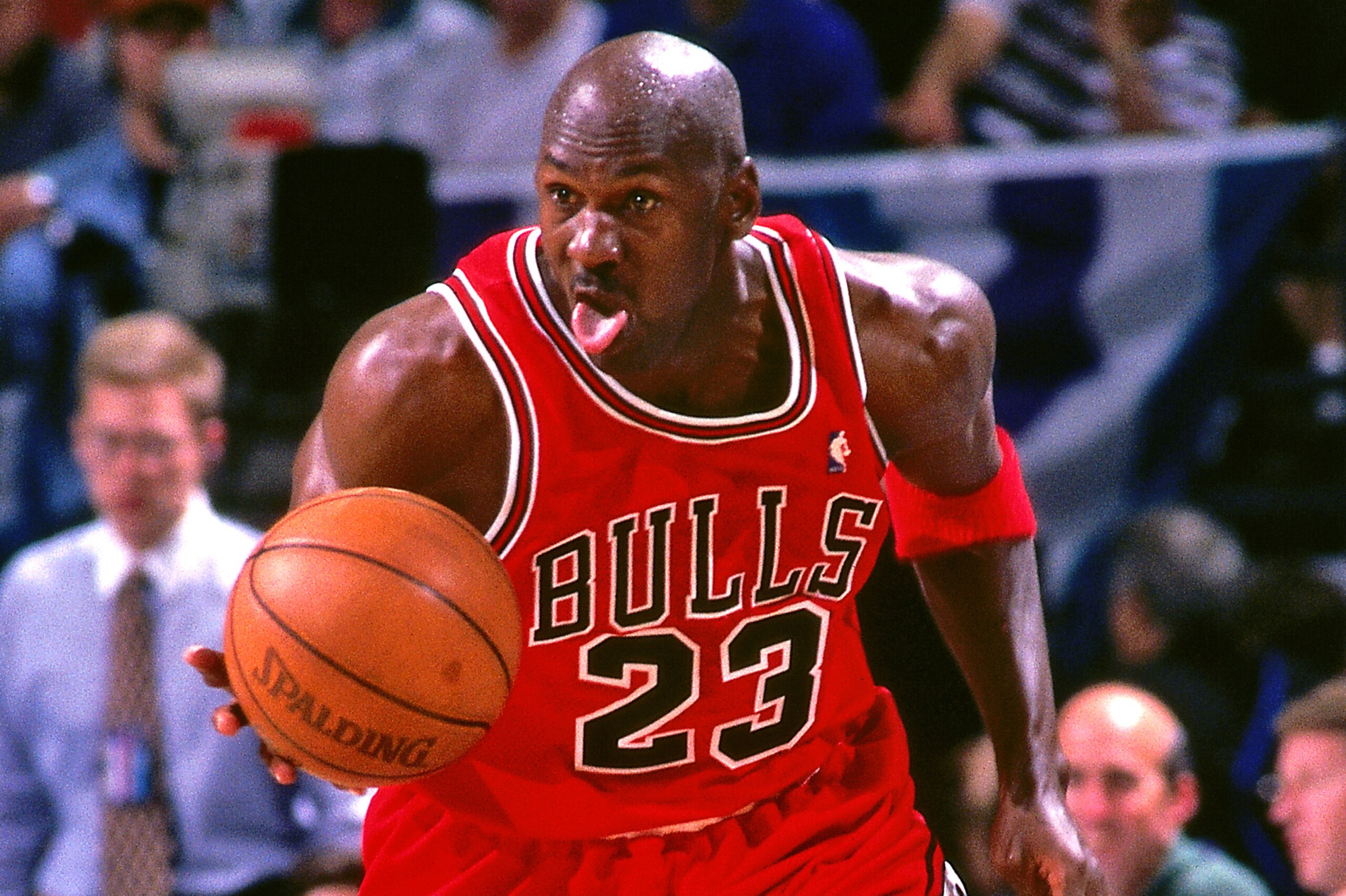 CHARLOTTE, NC - MAY 8:  Michael Jordan #23 of the Chicago Bulls handles the ball against the Charlotte Hornets on May 8, 1998 at Charlotte Coliseum in Charlotte, North Carolina. NOTE TO USER: User expressly acknowledges and agrees that, by downloading and