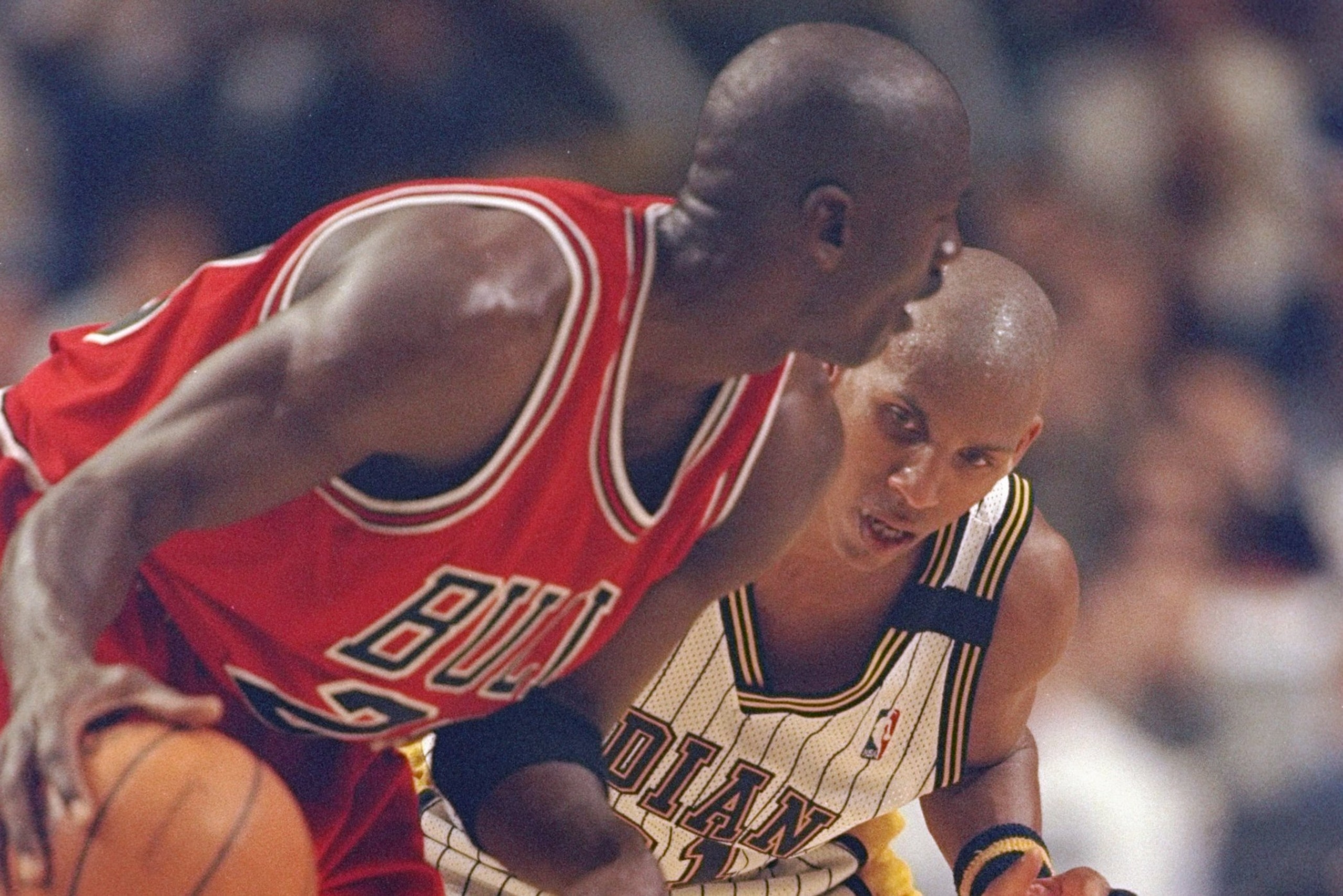 23 May, 1998:  Michael Jordan #23 of the Chicago Bulls driblbes past Reggie Miller #31 of the Indianapolis Pacers guards during the NBA Eastern Conference Finals at the Market Square Arena in Indianapolis, Indiana.  The Pacers defeated the Bulls 107-105. 