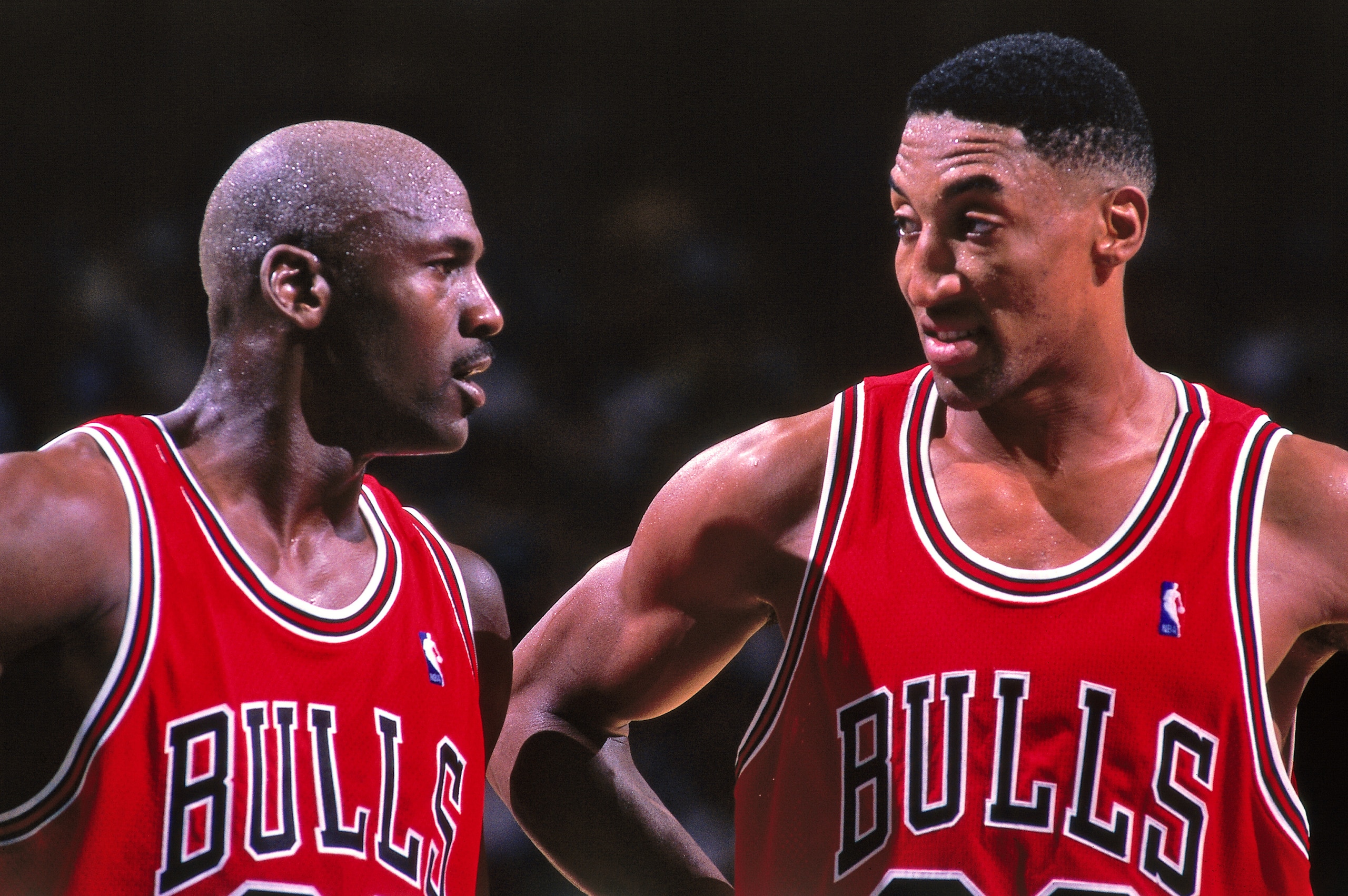CHARLOTTE, NC - MAY 8:  Michael Jordan #23 and Scottie Pippen #33 of the Chicago Bulls huddle together against the Charlotte Hornets on May 8, 1998 at Charlotte Coliseum in Charlotte, North Carolina. NOTE TO USER: User expressly acknowledges and agrees th