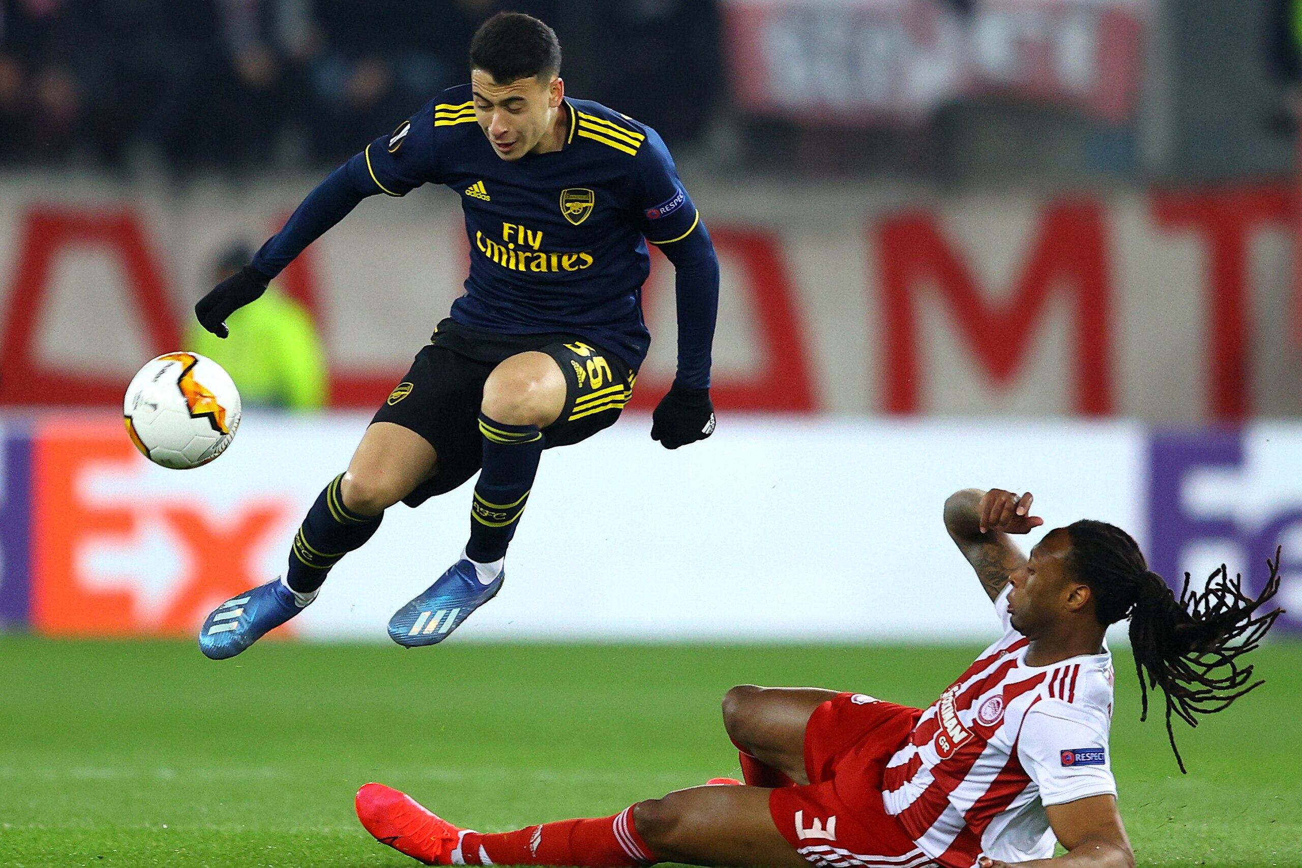 PIRAEUS, GREECE - FEBRUARY 20:  Gabriel Martinelli of Arsenal is challenged by Ruben Semedo of Olympiacos FC during the UEFA Europa League round of 32 first leg match between Olympiacos FC and Arsenal FC at Karaiskakis Stadium on February 20, 2020 in Pira