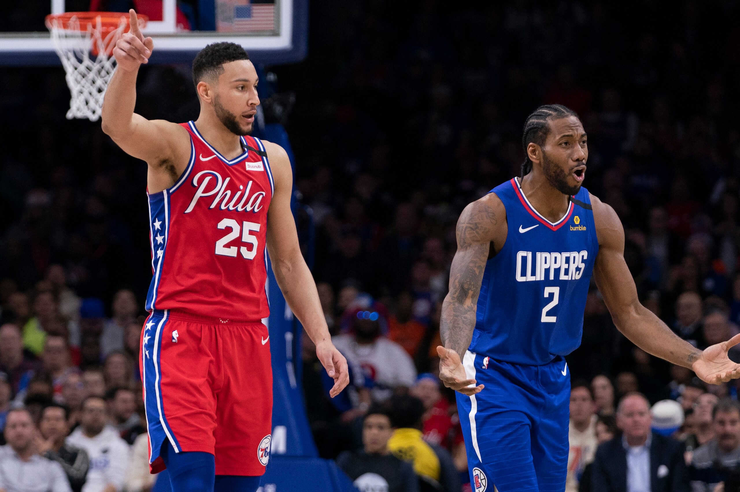 PHILADELPHIA, PA - FEBRUARY 11: Ben Simmons #25 of the Philadelphia 76ers and Kawhi Leonard #2 of the Los Angeles Clippers react to a play in the second quarter at the Wells Fargo Center on February 11, 2020 in Philadelphia, Pennsylvania. NOTE TO USER: Us