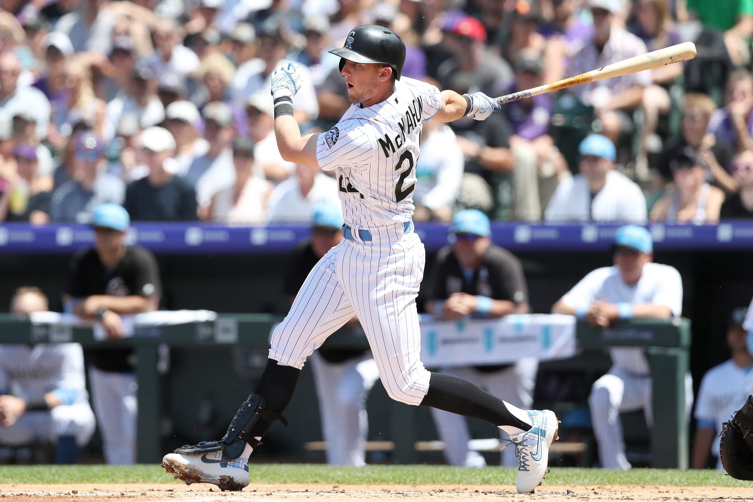 DENVER, COLORADO - JUNE 16: Ryan McMahon #24 of the Colorado Rockies hits a RBI single in the first inning against the San Diego Padres at Coors Field on June 16, 2019 in Denver, Colorado. (Photo by Matthew Stockman/Getty Images)