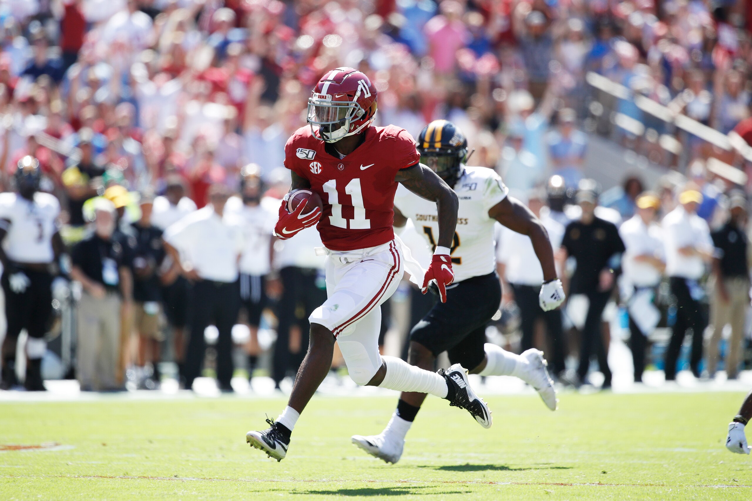TUSCALOOSA, AL - SEPTEMBER 21: Henry Ruggs III #11 of the Alabama Crimson Tide runs for a touchdown after catching a pass during a game against the Southern Mississippi Golden Eagles at Bryant-Denny Stadium on September 21, 2019 in Tuscaloosa, Alabama. Al