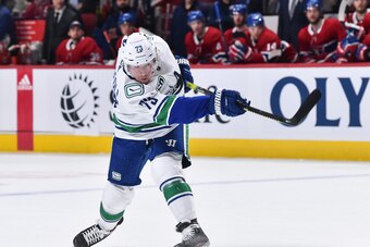 MONTREAL, QC - FEBRUARY 25:  Tyler Toffoli #73 of the Vancouver Canucks takes a shot against the Montreal Canadiens during the third period at the Bell Centre on February 25, 2020 in Montreal, Canada.  The Vancouver Canucks defeated the Montreal Canadiens