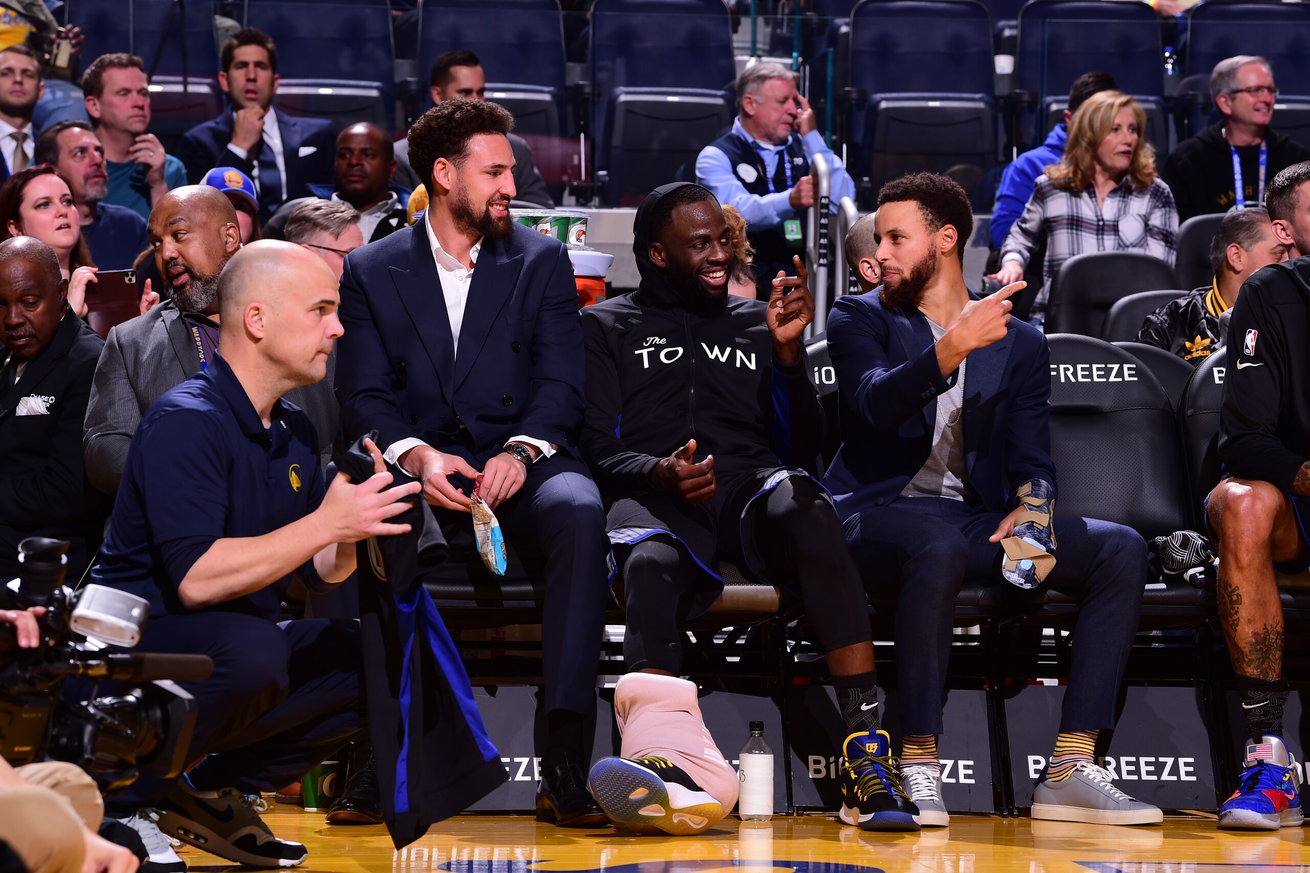 SAN FRANCISCO, CA - NOVEMBER 27: Klay Thompson #11, Draymond Green #23, and Stephen Curry #30 of the Golden State Warriors smile during a game against the Chicago Bulls on November 27, 2019 at Chase Center in San Francisco, California. NOTE TO USER: User 