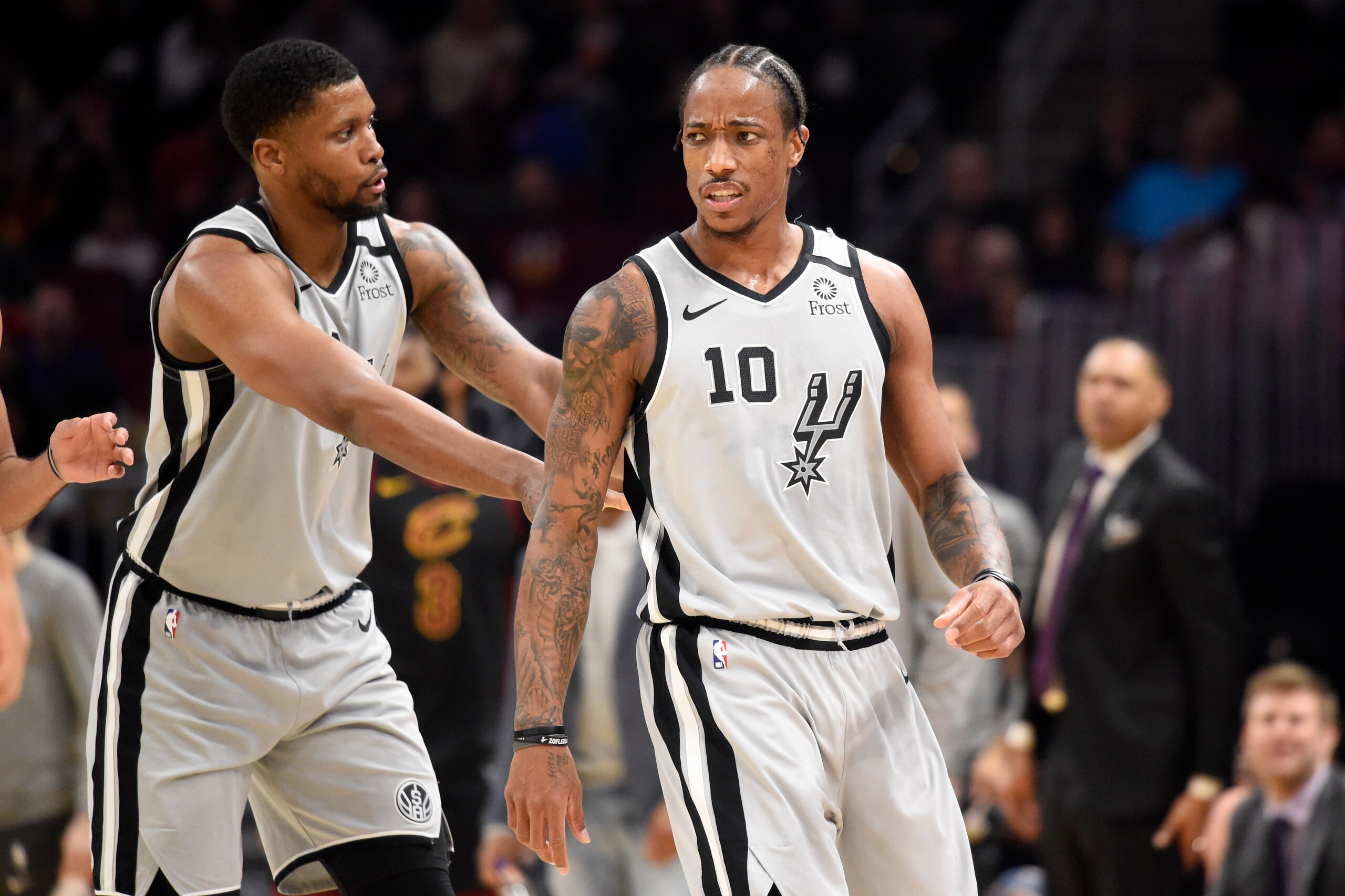 CLEVELAND, OHIO - MARCH 08: Rudy Gay #22 helps DeMar DeRozan #10 of the San Antonio Spurs as he reacts during the second half against the Cleveland Cavaliers at Rocket Mortgage Fieldhouse on March 08, 2020 in Cleveland, Ohio. The Cavaliers defeated the Sp