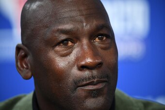 Former NBA star and owner of Charlotte Hornets team Michael Jordan gestures as he addresses a press conference ahead of the NBA basketball match between Milwaukee Bucks and Charlotte Hornets at The AccorHotels Arena in Paris on January 24, 2020. (Photo by