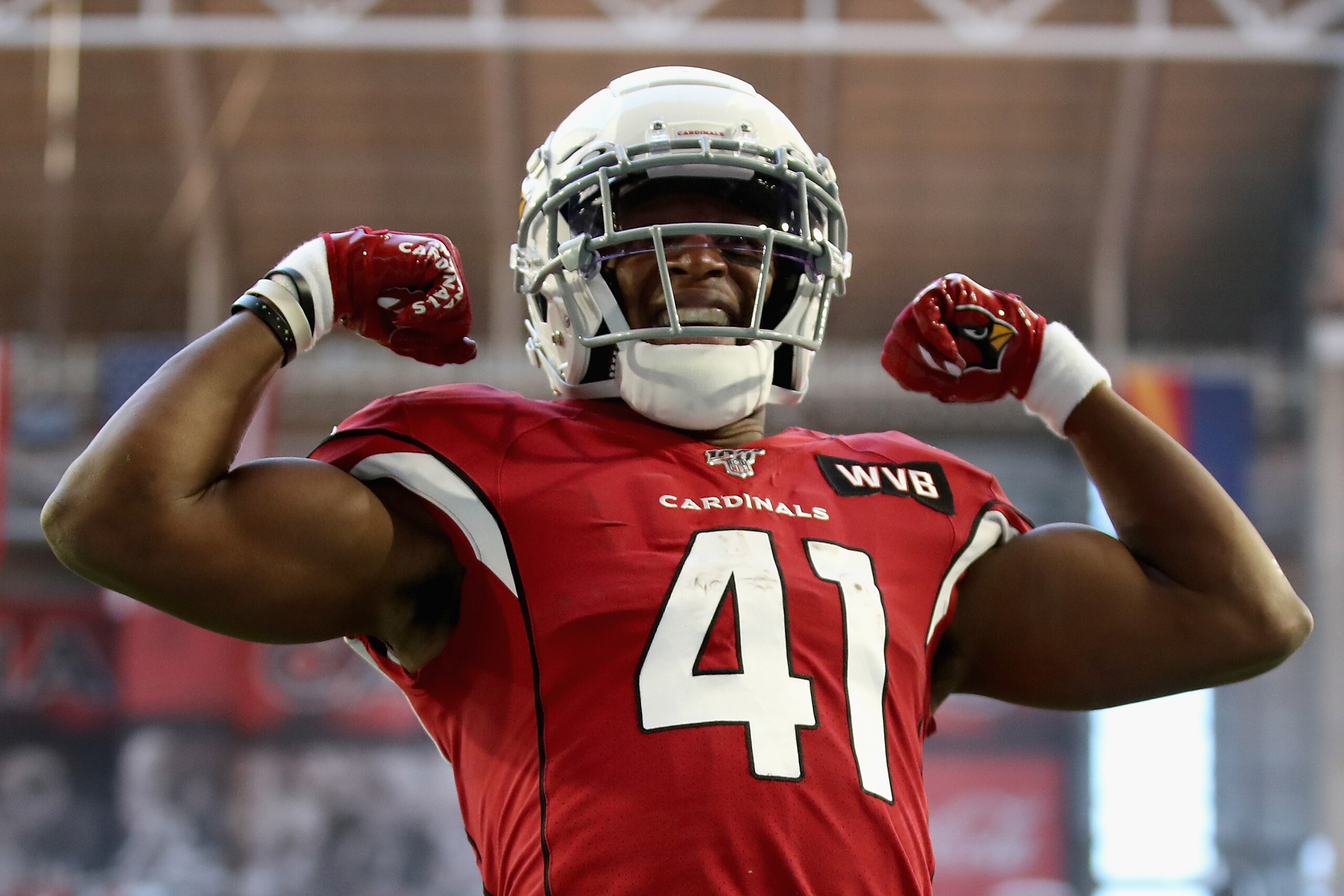 GLENDALE, ARIZONA - DECEMBER 15: Running back Kenyan Drake #41 of the Arizona Cardinals celebrates after scoring on a five yard rushing touchdown against the Cleveland Browns during the first half of the NFL game at State Farm Stadium on December 15, 2019