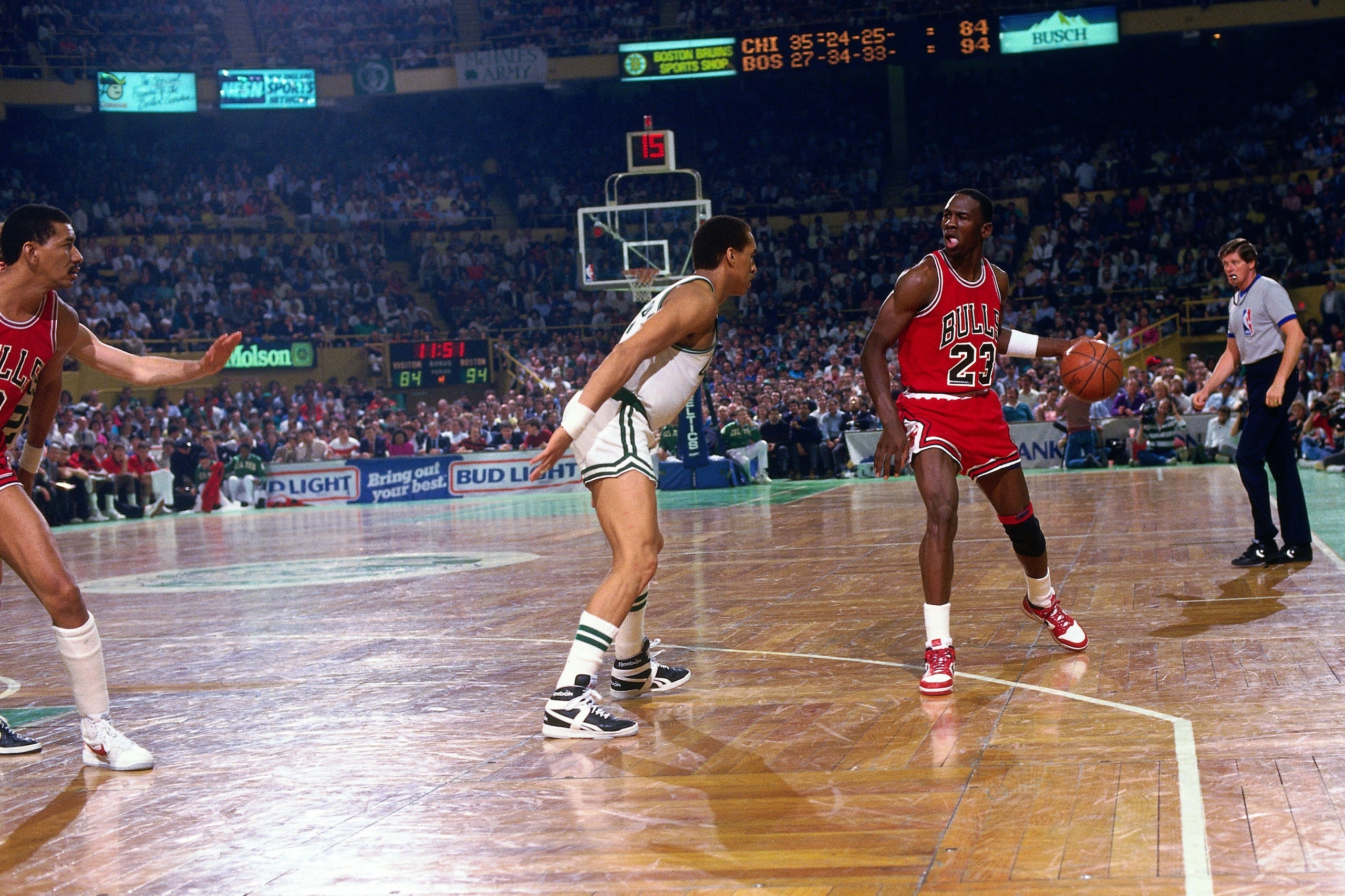 BOSTON - APRIL 17: Michael Jordan #23 of the Chicago Bulls moves the ball up court against Dennis Johnson #3 of the Boston Celtics in Game One of the Eastern Conference Quarterfinals during the 1986 NBA Playoffs played on April 17, 1986 at the Boston Gar BOSTON - APRIL 17: Michael Jordan #23 of the Chicago Bulls moves the ball up court against Dennis Johnson #3 of the Boston Celtics in Game One of the Eastern Conference Quarterfinals during the 1986 NBA Playoffs played on April 17, 1986 at the Boston Gar