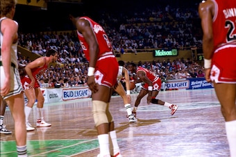 BOSTON - APRIL 17:  Michael Jordan #23 of the Chicago Bulls moves the ball up court against the Boston Celtics during Game One of the Eastern Conference Quarterfinals played on April 17, 1986 at the Boston Garden in Boston, Massachusetts. The Celtics won 