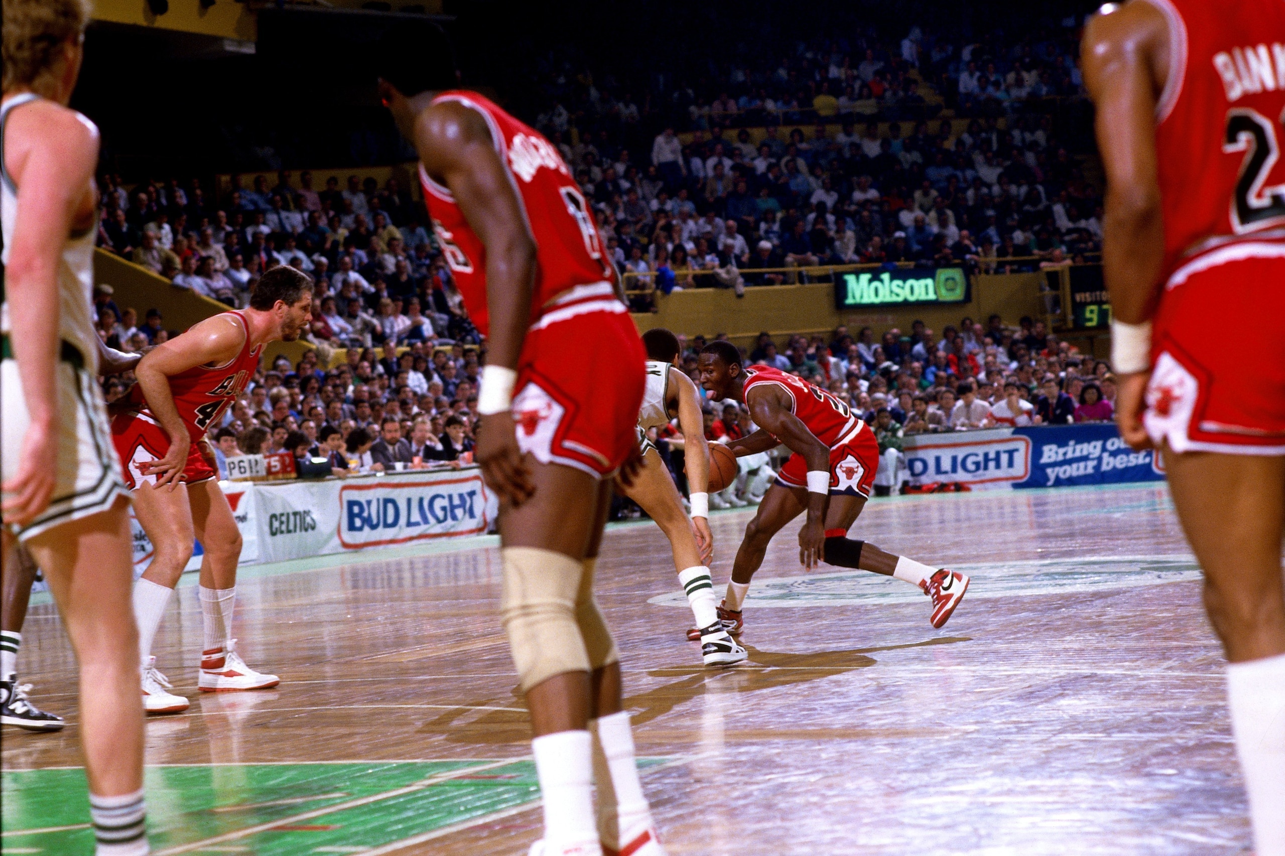 BOSTON - APRIL 17: Michael Jordan #23 of the Chicago Bulls moves the ball up court against the Boston Celtics during Game One of the Eastern Conference Quarterfinals played on April 17, 1986 at the Boston Garden in Boston, Massachusetts. The Celtics won BOSTON - APRIL 17: Michael Jordan #23 of the Chicago Bulls moves the ball up court against the Boston Celtics during Game One of the Eastern Conference Quarterfinals played on April 17, 1986 at the Boston Garden in Boston, Massachusetts. The Celtics won