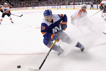 NEW YORK, NEW YORK - FEBRUARY 11: Mathew Barzal #13 of the New York Islanders skates against the Philadelphia Flyers at the Barclays Center on February 11, 2020 in the Brooklyn borough of New York City. The Islanders defeated the Flyers 5-3. (Photo by Bru