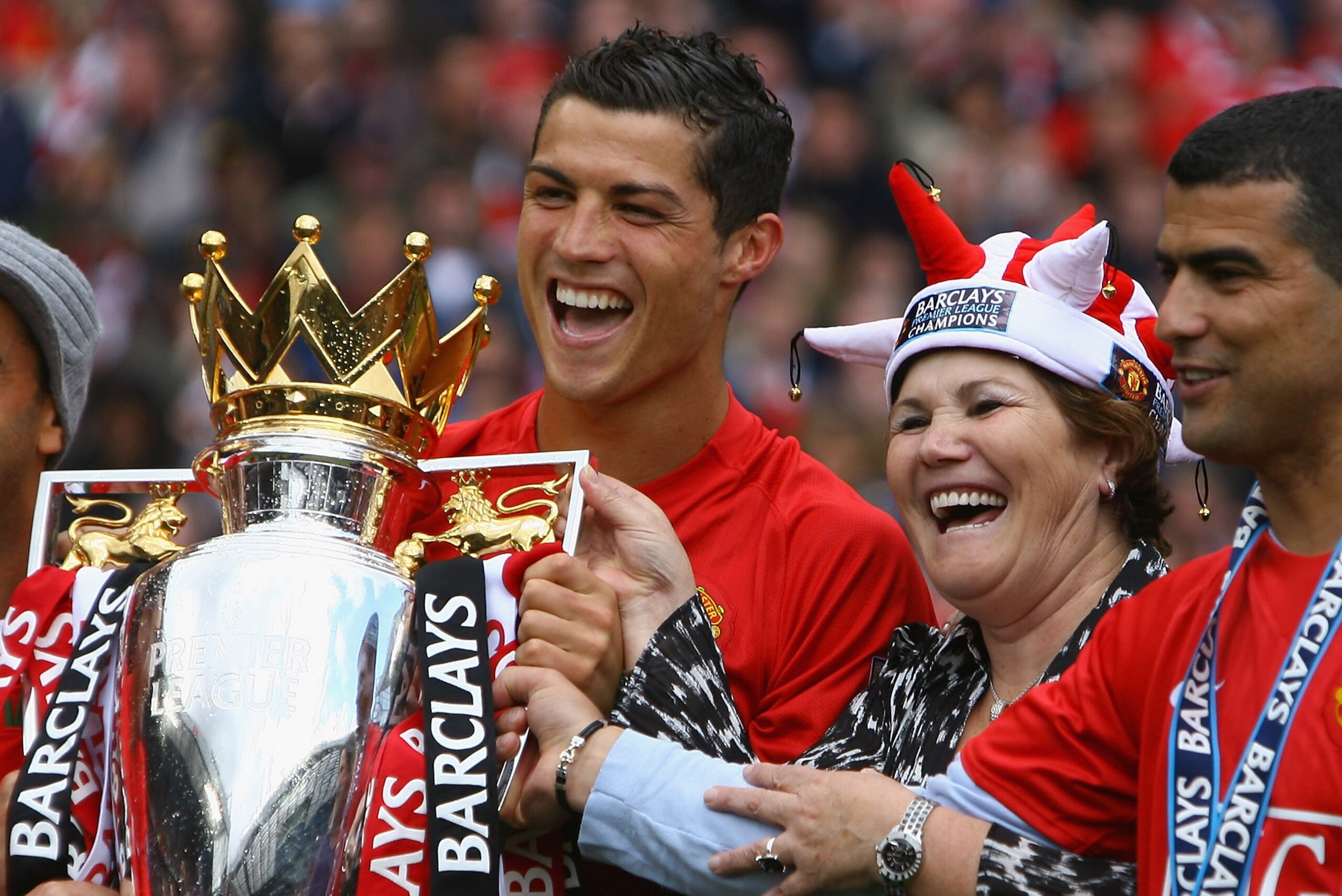 MANCHESTER, ENGLAND - MAY 16:  Cristiano Ronaldo of Manchester United celebrates winning the Barclays Premier League trophy with his mother, Dolores Aveiro after the Barclays Premier League match between Manchester United and Arsenal at Old Trafford on Ma