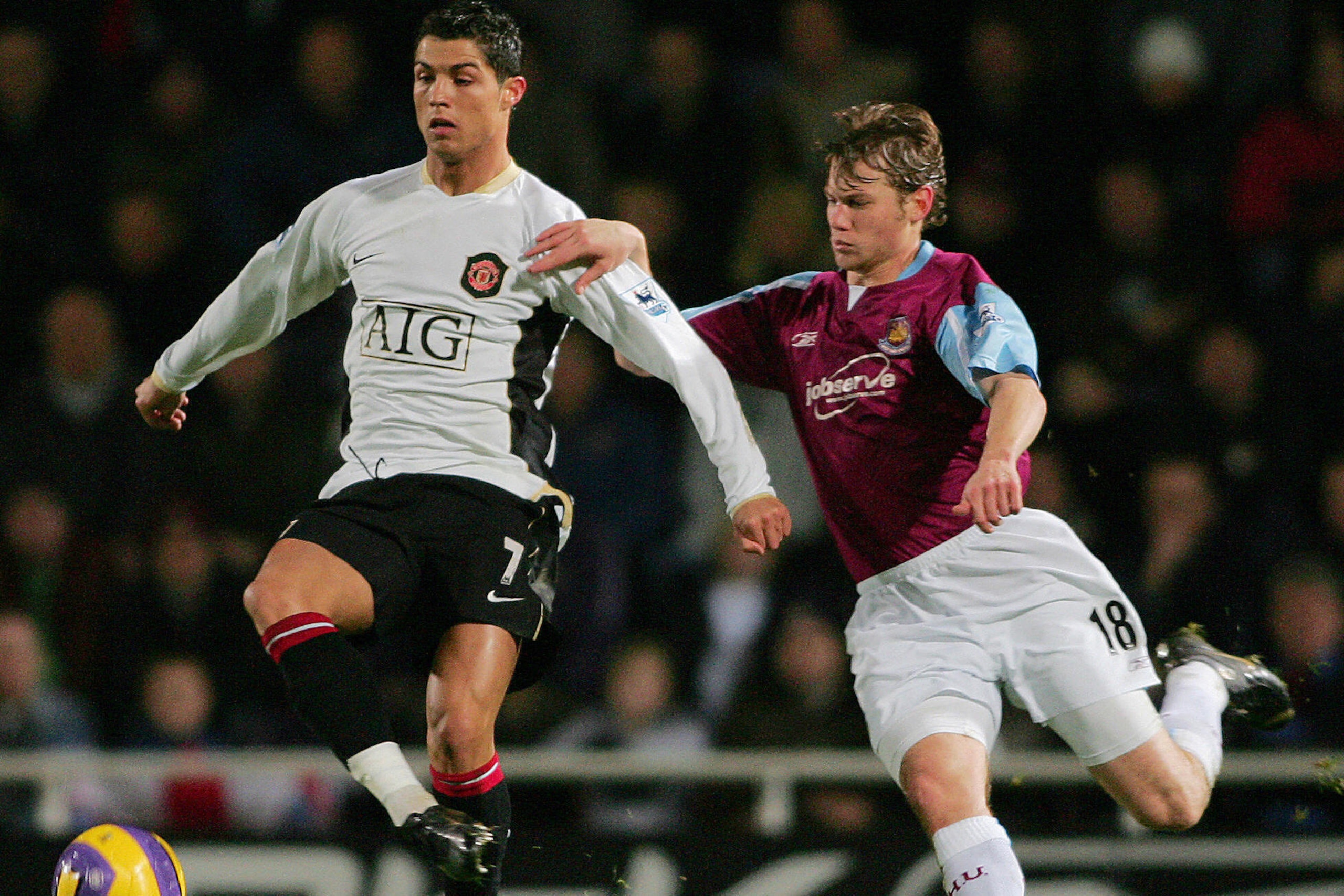 LONDON, UNITED KINGDOM:  Manchester United's Cristiano Ronaldo (L) vies with West Ham's Johnathan Spector (R) during their Premiership match at home to West Ham, 17 December 2006. West Ham won the match 1-0. AFP PHOTO/CARL DE SOUZA. Mobile and website use