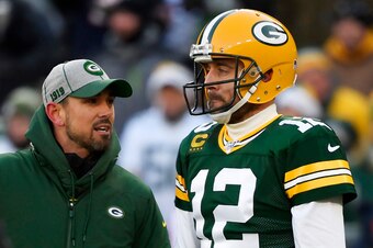 GREEN BAY, WISCONSIN - DECEMBER 15: head coach Matt LaFleur of the Green Bay Packers discusses with Aaron Rodgers #12 of the Green Bay Packers during warms up before the game against the Chicago Bears at Lambeau Field on December 15, 2019 in Green Bay, Wi