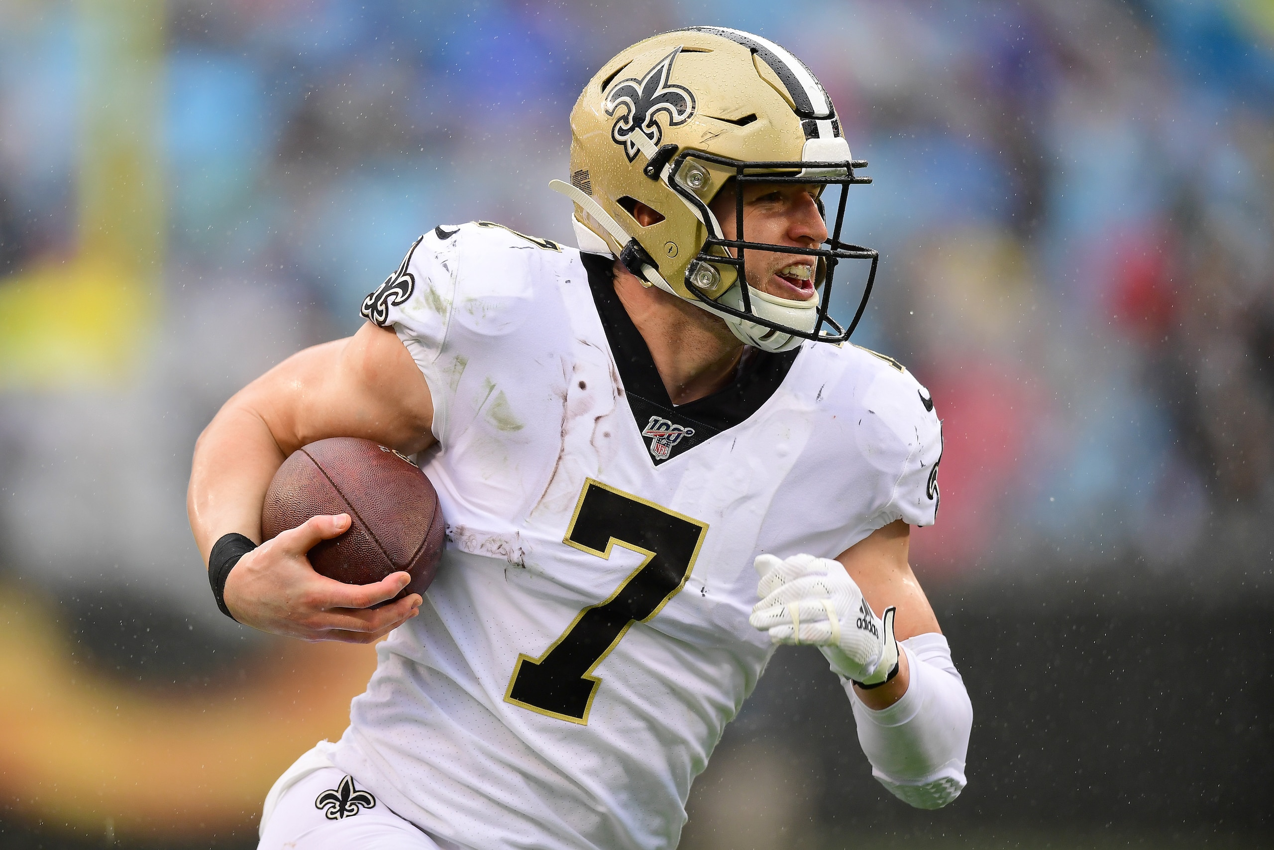 CHARLOTTE, NORTH CAROLINA - DECEMBER 29: Taysom Hill #7 of the New Orleans Saints scores a touchdown during the third quarter during their game against the Carolina Panthers at Bank of America Stadium on December 29, 2019 in Charlotte, North Carolina. (Ph
