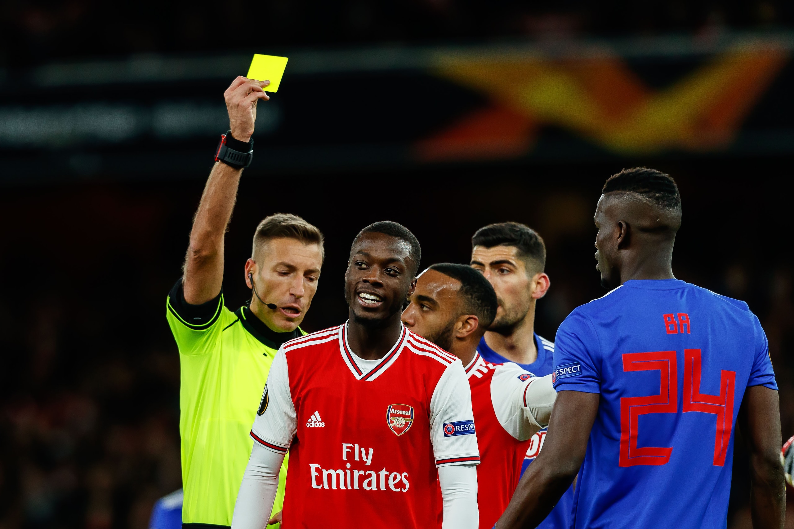 LONDON, ENGLAND - FEBRUARY 27: (BILD ZEITUNG OUT) referee Davide Massa shows Nicolas Pepe of Arsenal FC the yellow card during the UEFA Europa League round of 32 second leg match between Arsenal FC and Olympiacos FC at Emirates Stadium on February 27, 202