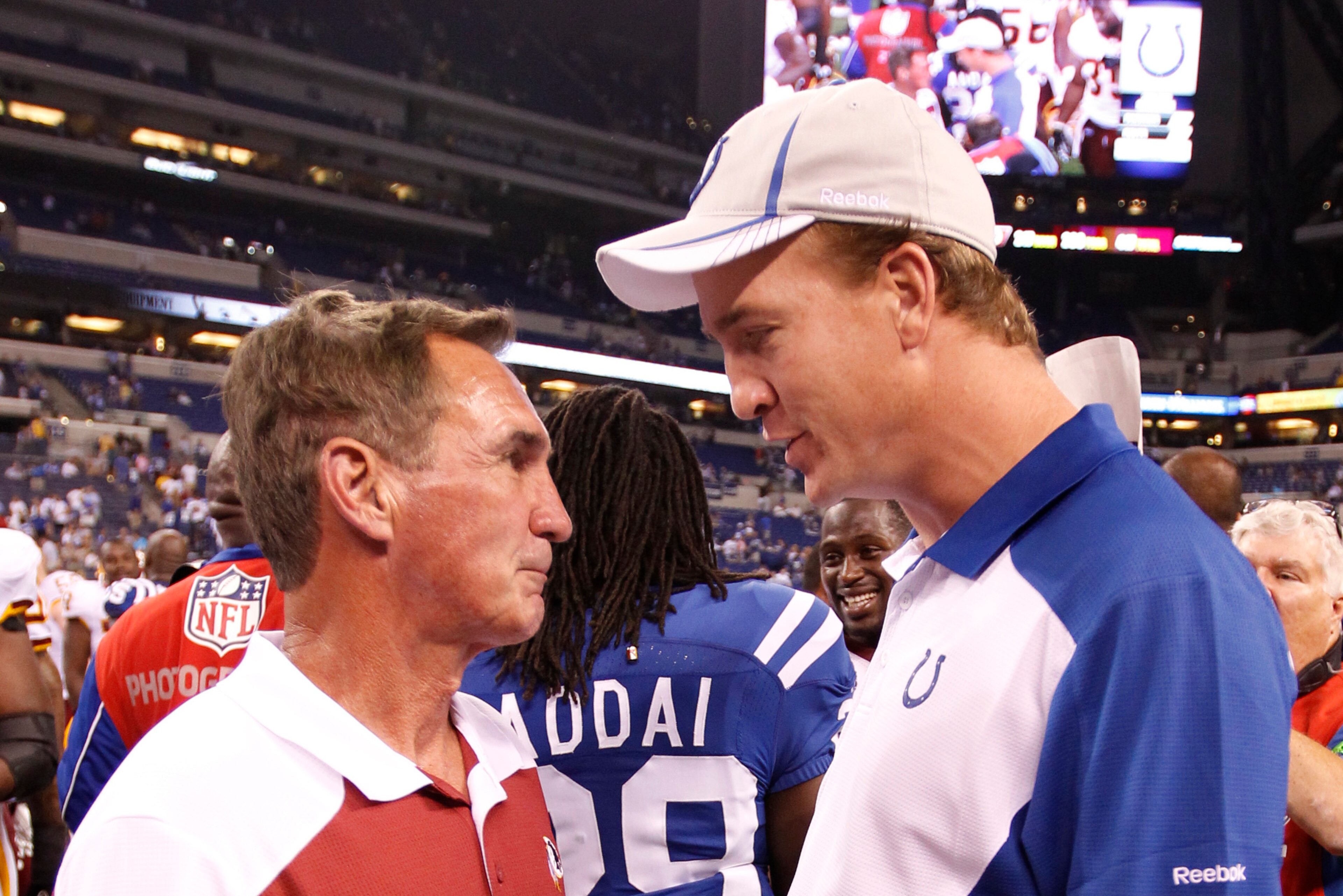 Former NFL coach Mike Shanahan regularly met with Manning each year at the NFL Draft Scouting Combine to discuss game strategy. Former NFL coach Mike Shanahan regularly met with Manning each year at the NFL Draft Scouting Combine to discuss game strategy.