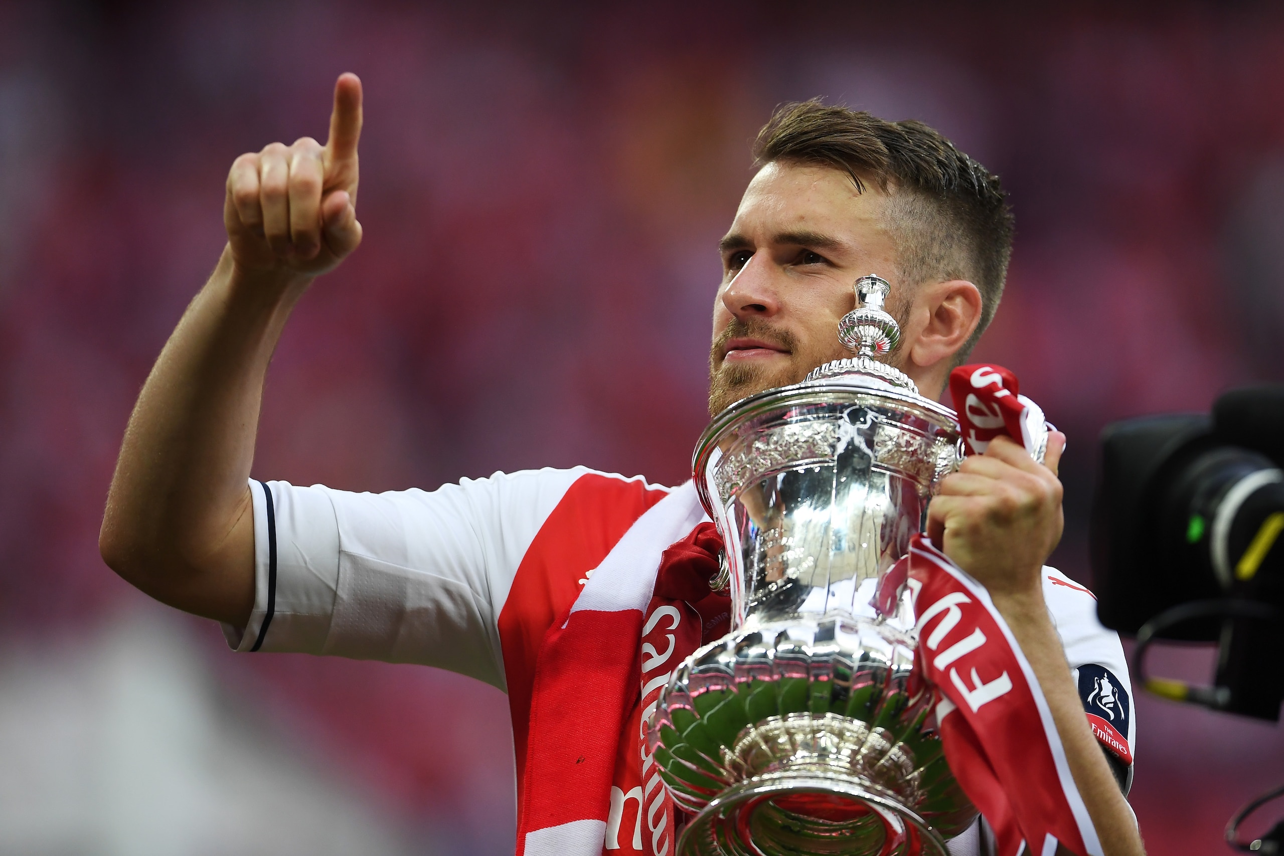 LONDON, ENGLAND - MAY 27: Aaron Ramsey of Arsenal celebrates with the trophy after The Emirates FA Cup Final between Arsenal and Chelsea at Wembley Stadium on May 27, 2017 in London, England. (Photo by Laurence Griffiths/Getty Images) LONDON, ENGLAND - MAY 27: Aaron Ramsey of Arsenal celebrates with the trophy after The Emirates FA Cup Final between Arsenal and Chelsea at Wembley Stadium on May 27, 2017 in London, England. (Photo by Laurence Griffiths/Getty Images)